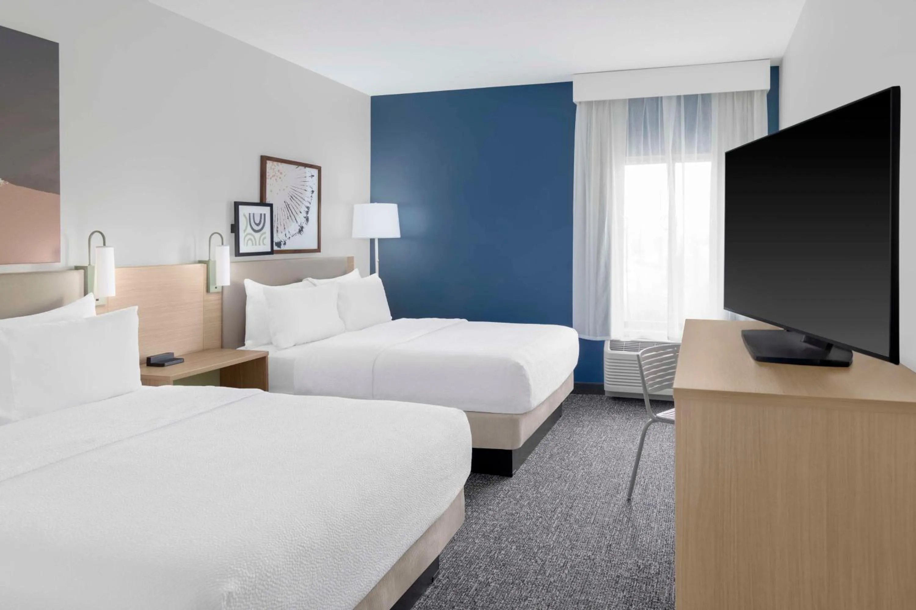 Queen Room with Two Queen Beds and Mobility Accessible Tub in Spark By Hilton Lansing