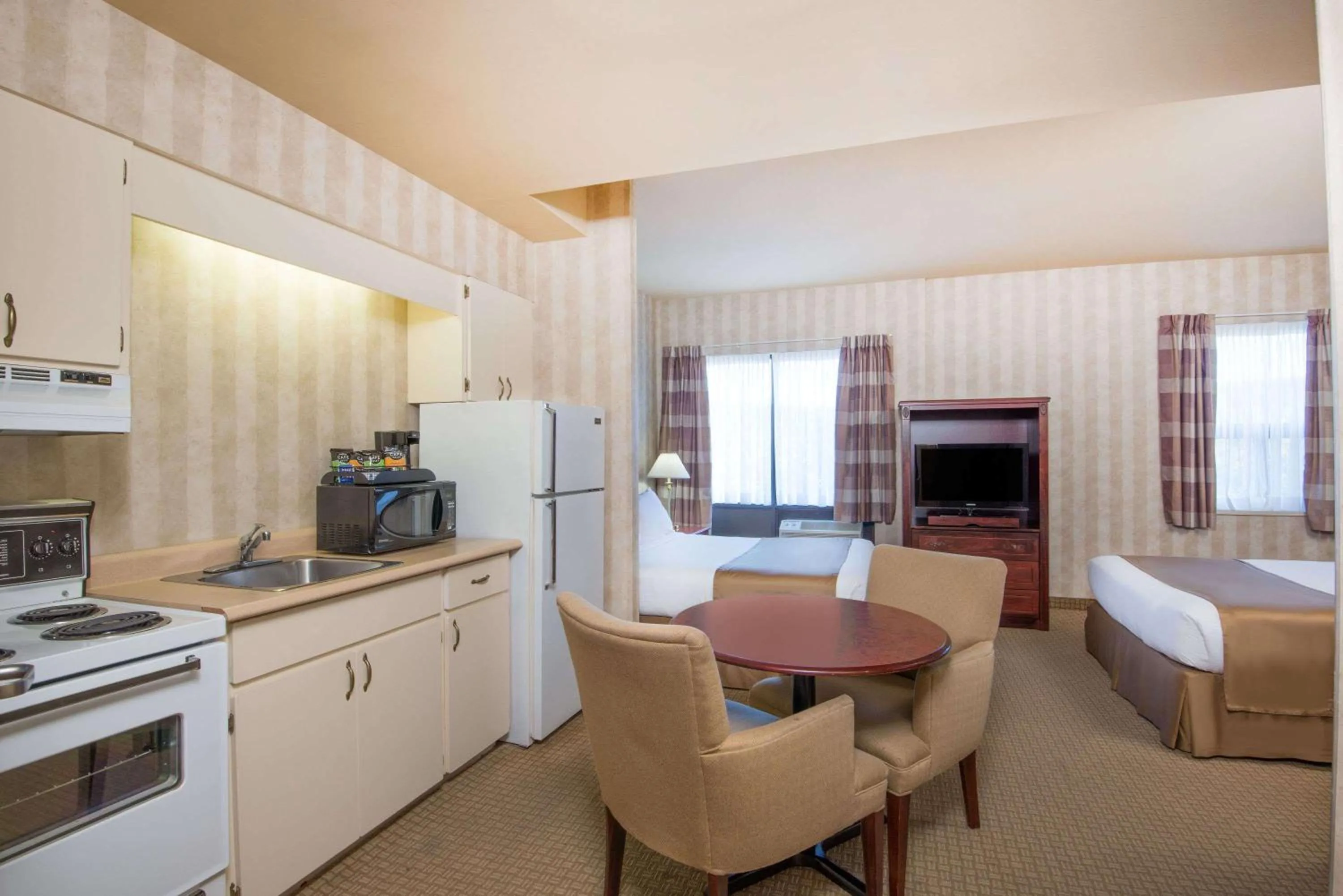 Queen Room with Two Queen Beds and Kitchenette in Ramada by Wyndham St. John's