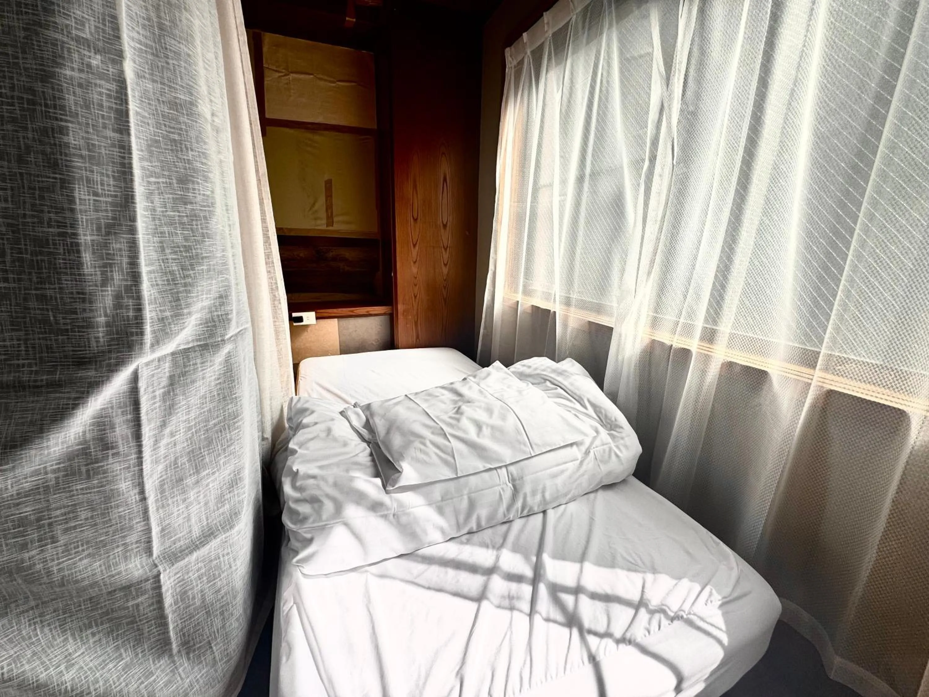 Single Bed in Female Dormitory Room in Osaka Guesthouse Sakura
