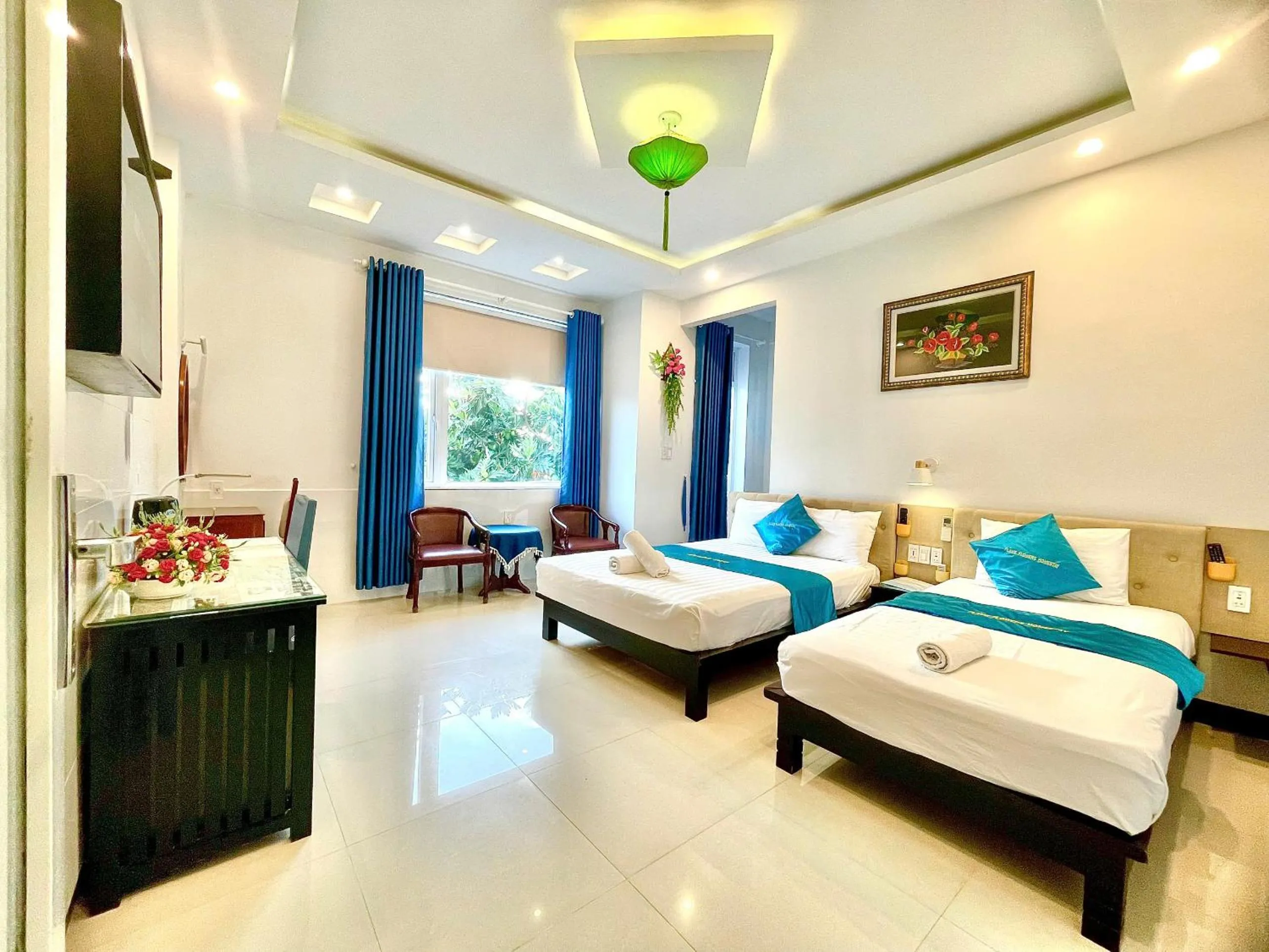 Triple Room with Balcony - single occupancy in Flame Flowers Homestay