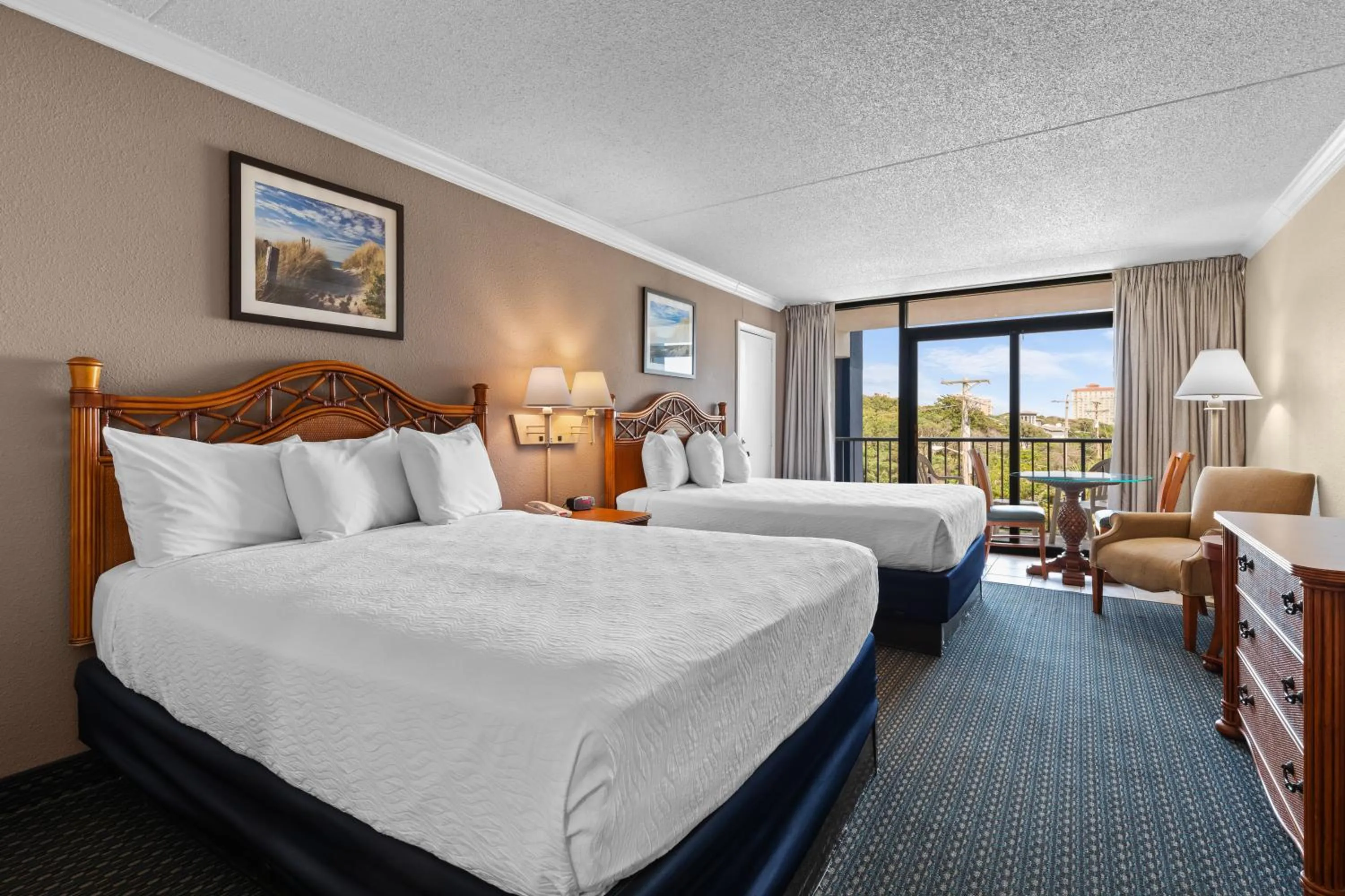 Queen Room with Two Queen Beds and Kitchen - Side Ocean View in Grande Shores