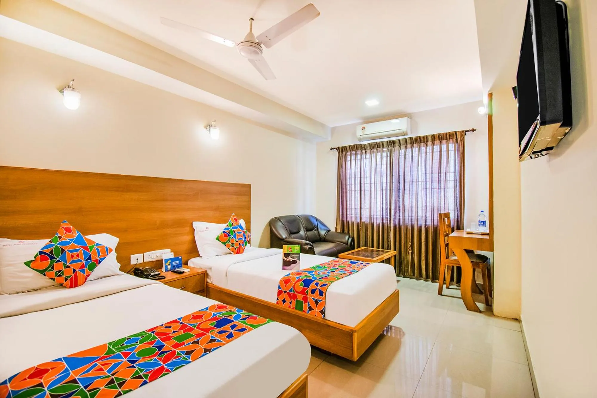 Executive Triple Room - single occupancy in FabHotel Jansi Deluxe - Nr Gandhipuram Bus stand