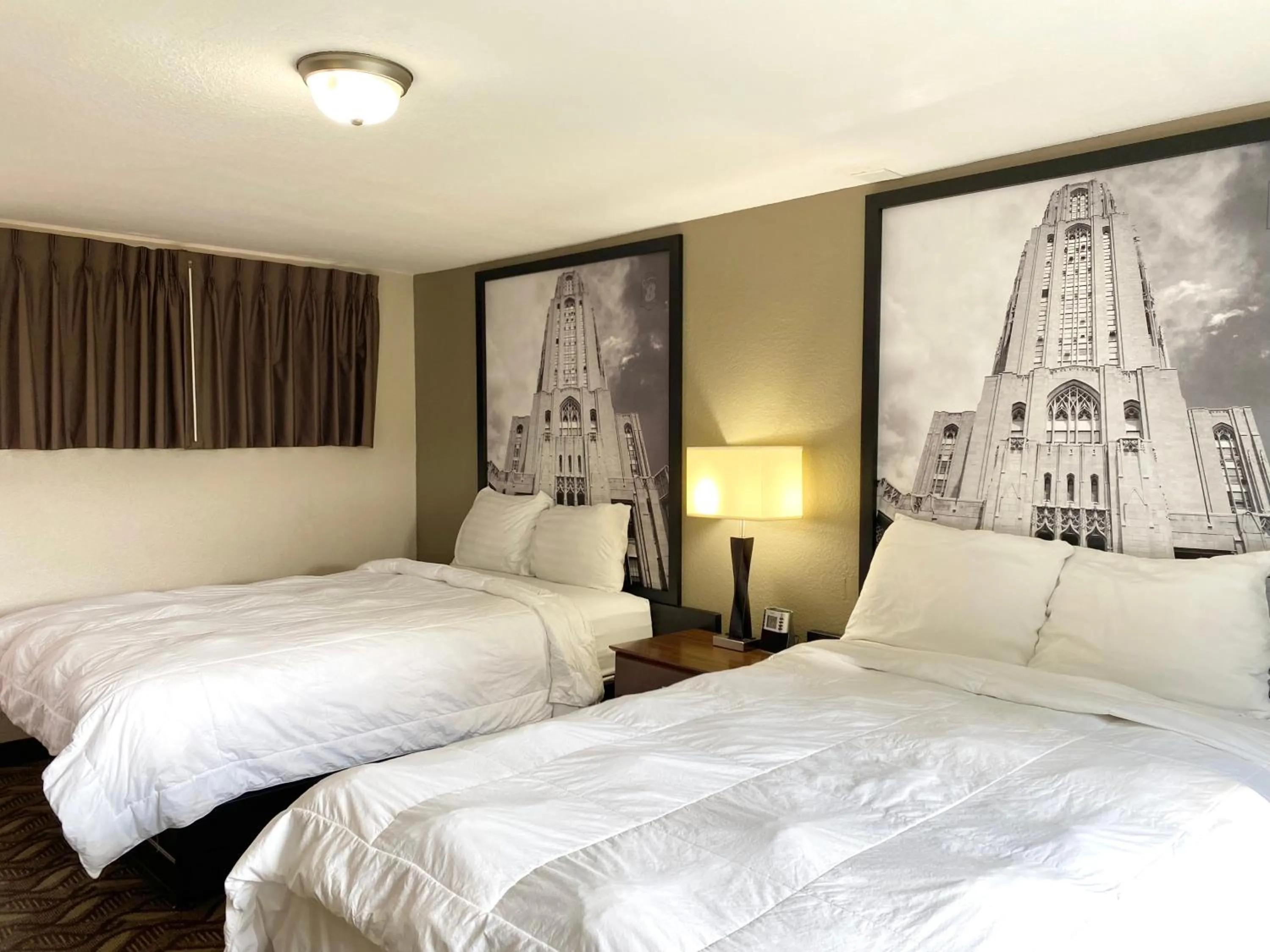 Deluxe Room with One King Bed and Two Double Beds, Non-Smoking in Super 8 by Wyndham Greensburg