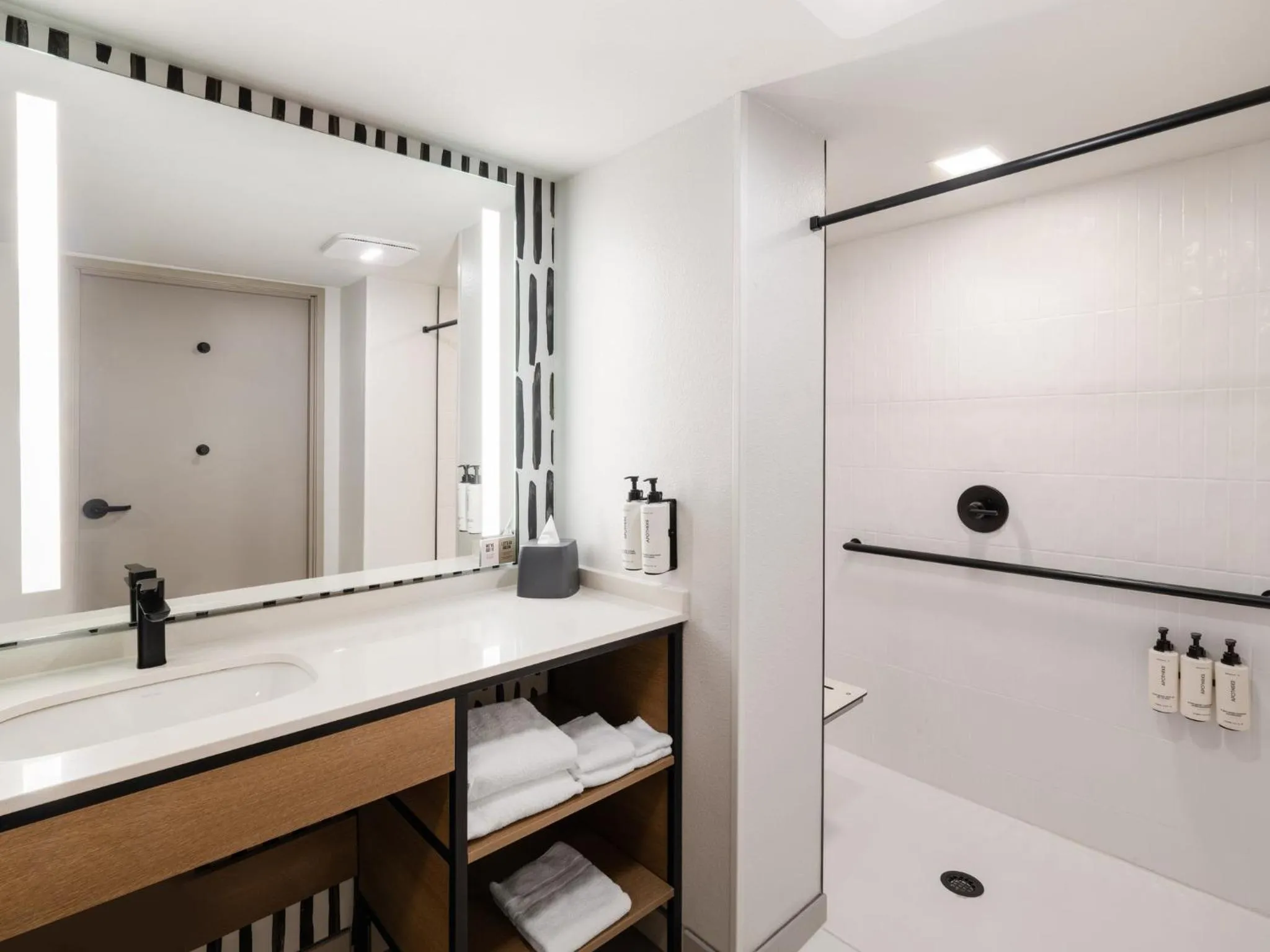 King Suite with Mobility Accessible Roll-In Shower in Atwell Suites Austin Airport by IHG
