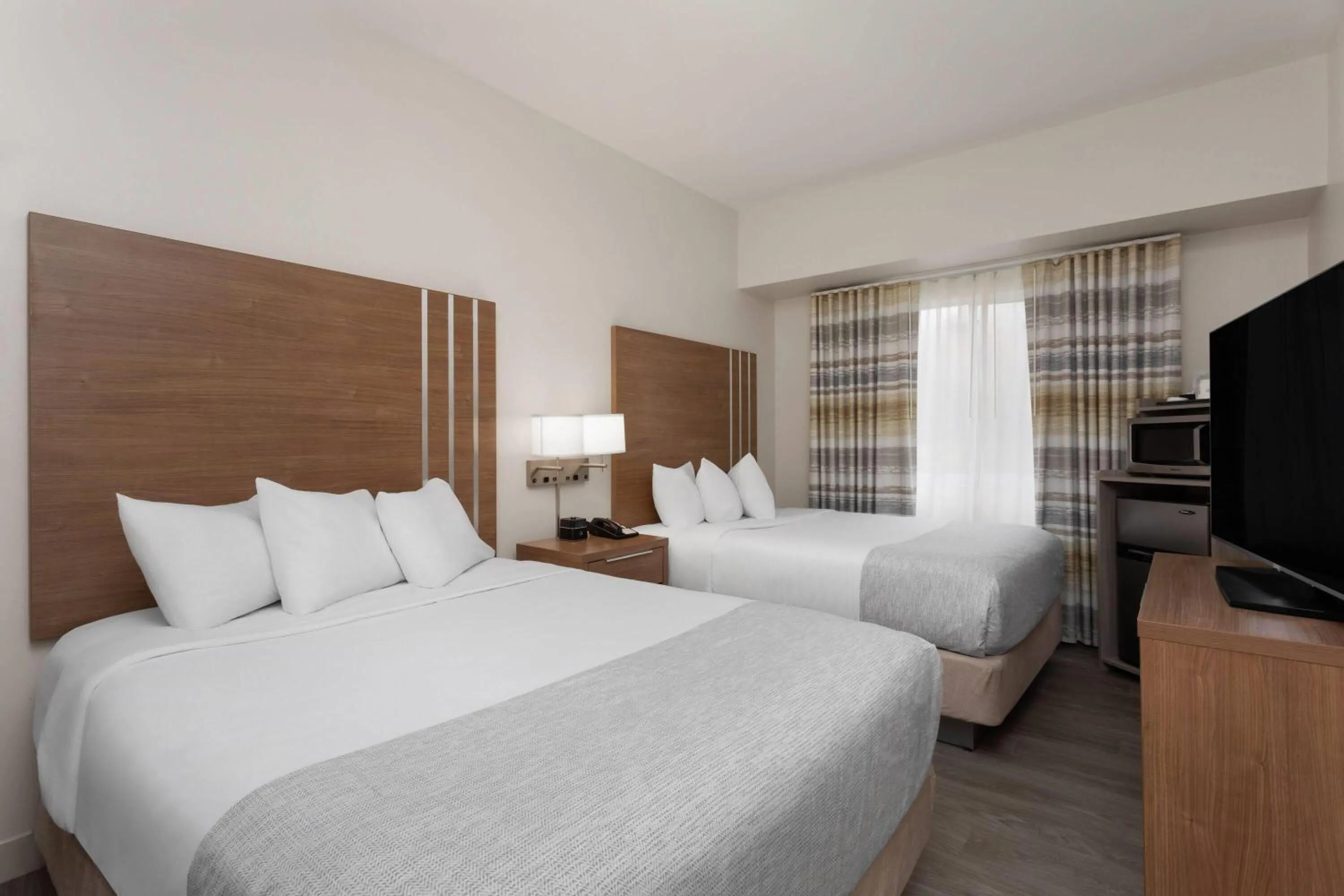 Queen Room with Two Queen Beds - Non-Smoking in Hawthorn Extended Stay by Wyndham Naples