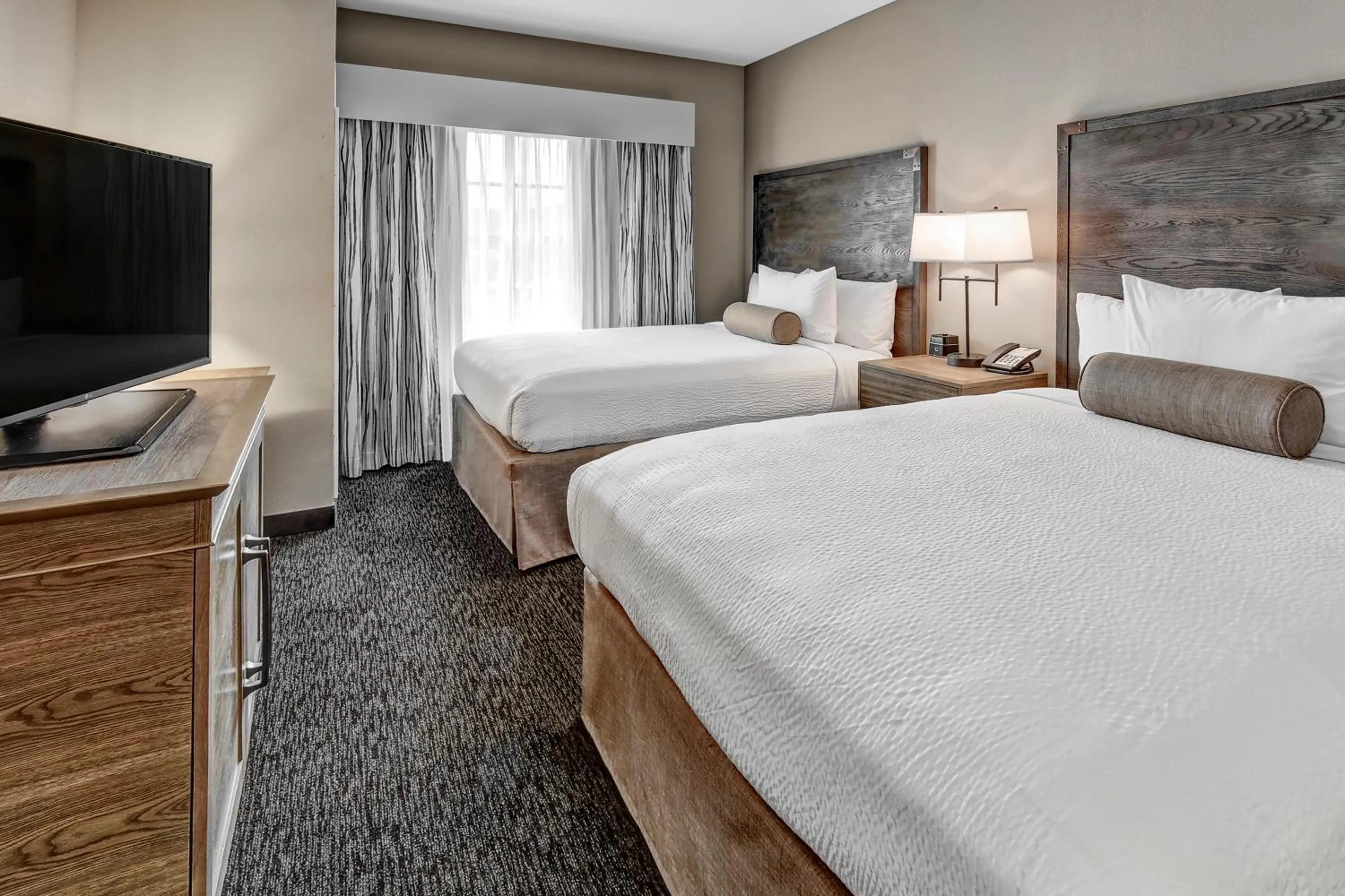 Junior Suite with Two Queen Beds in Black Fox Lodge Pigeon Forge, Tapestry Collection by Hilton