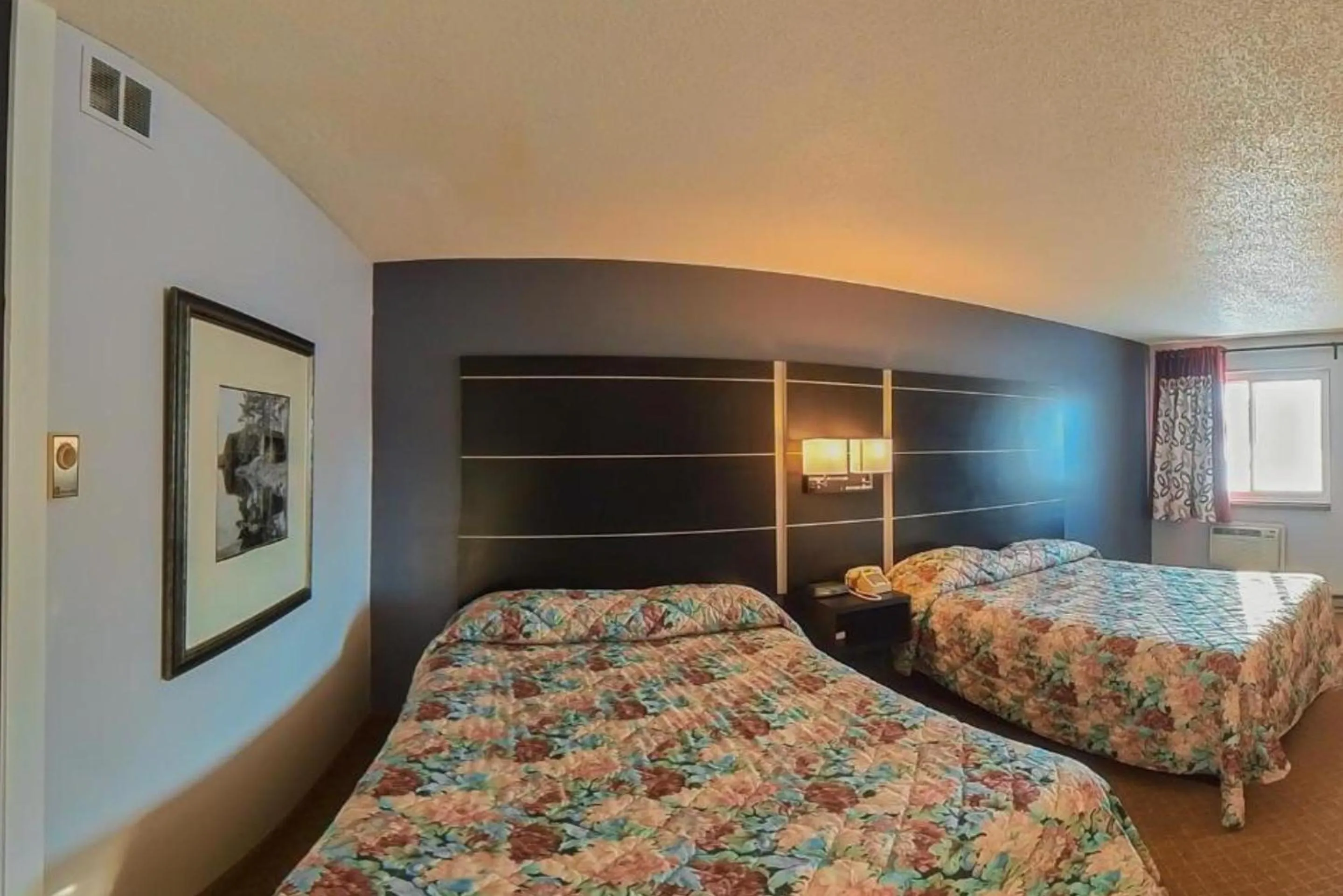 Queen Room with Two Queen Beds - Smoking in Coratel Inn & Suites by Jasper Hastings