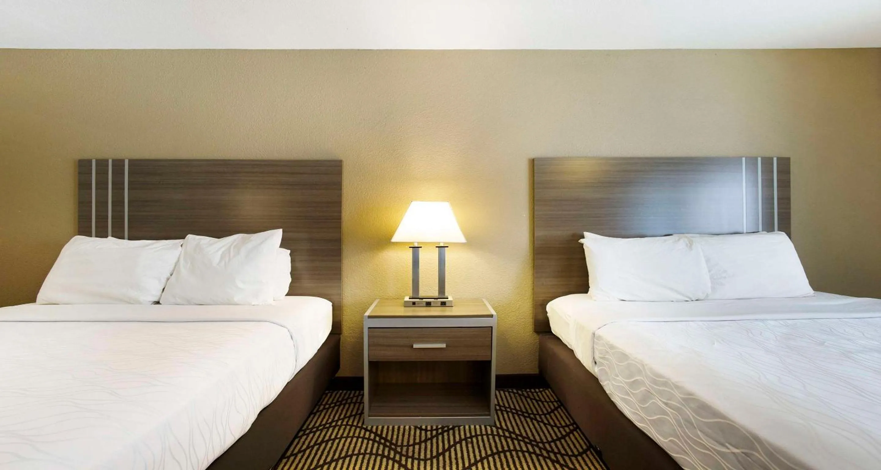Queen Room with Two Queen Beds with Balcony - Garden View in SureStay Plus Hotel by Best Western Sacramento North