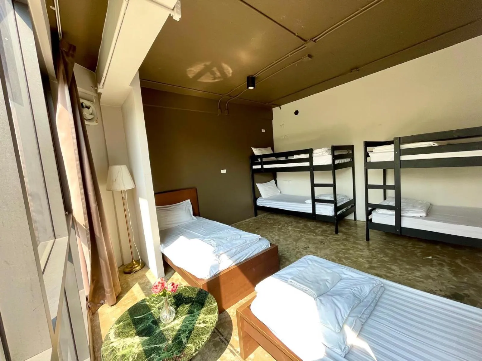 Private Family room with shared washroom in Collection O The Spades Hostel