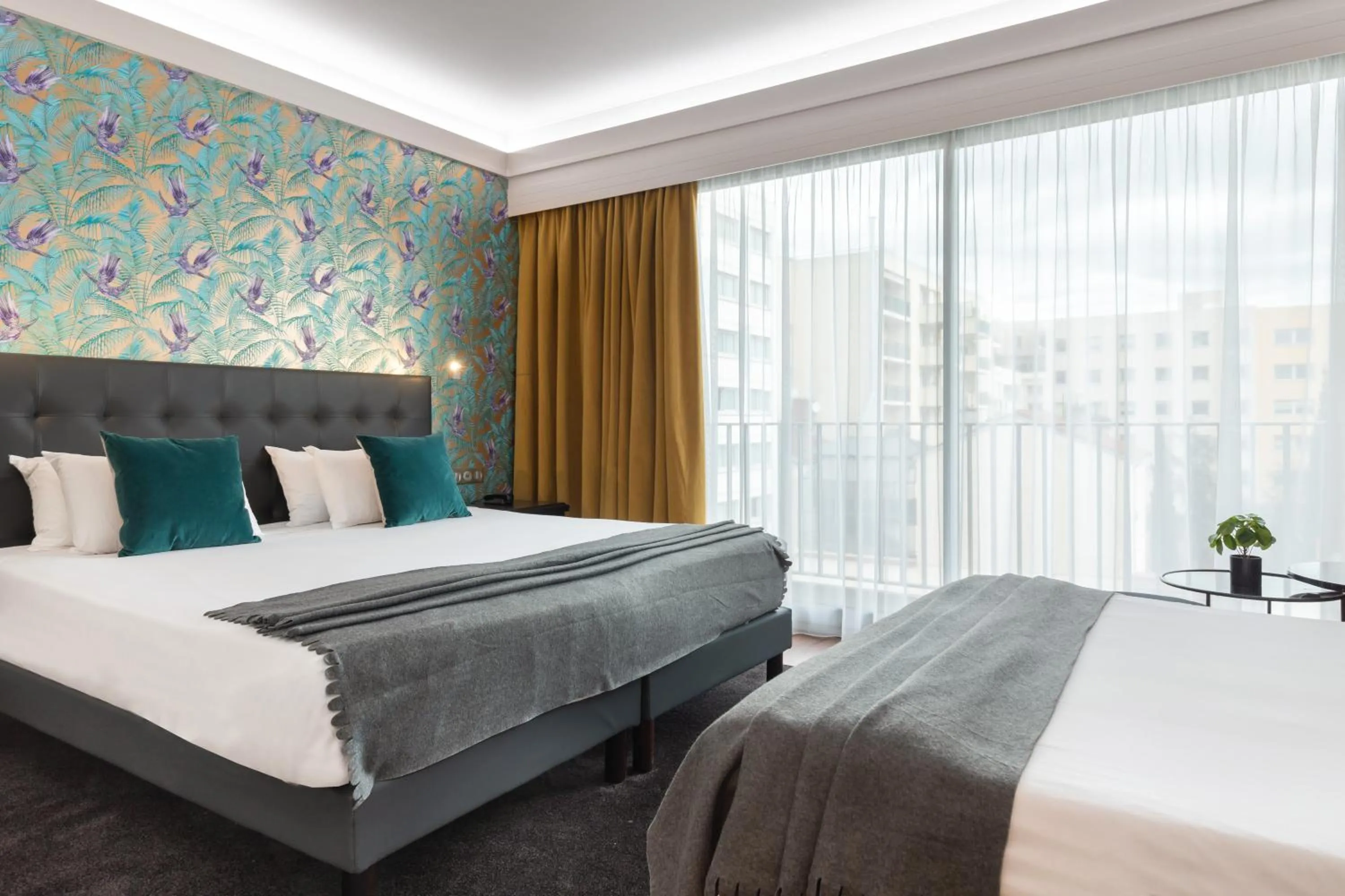 Triple Room in Hôtel Charlemagne by Happyculture