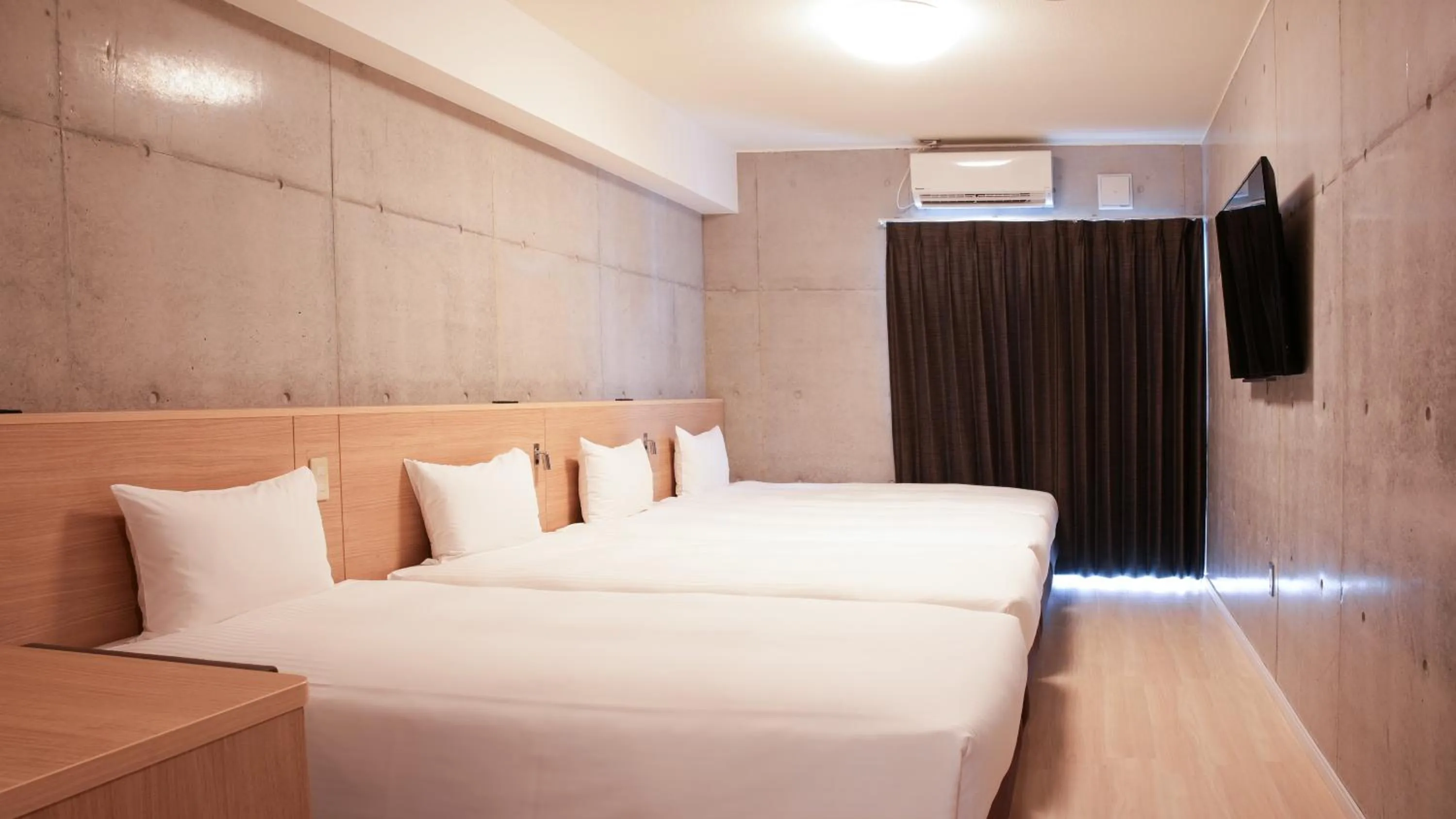 Economy Quadruple Room - single occupancy - Hotel Building in The BREAKFAST HOTEL PORTO Ishigakijima