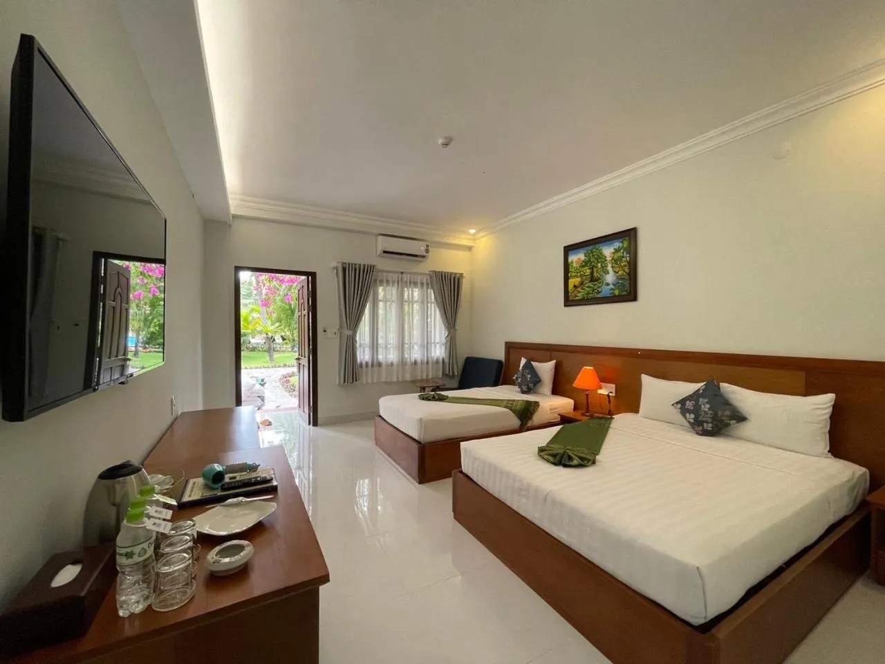 Deluxe Triple with Balcony and Garden View in Four Oceans Beach Resort - Bon Bien Mui Ne