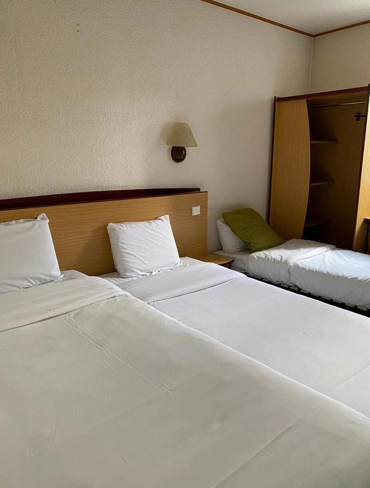 Room with 2 Single Beds and 1 Junior Bed in Kyriad Le Blanc-Mesnil