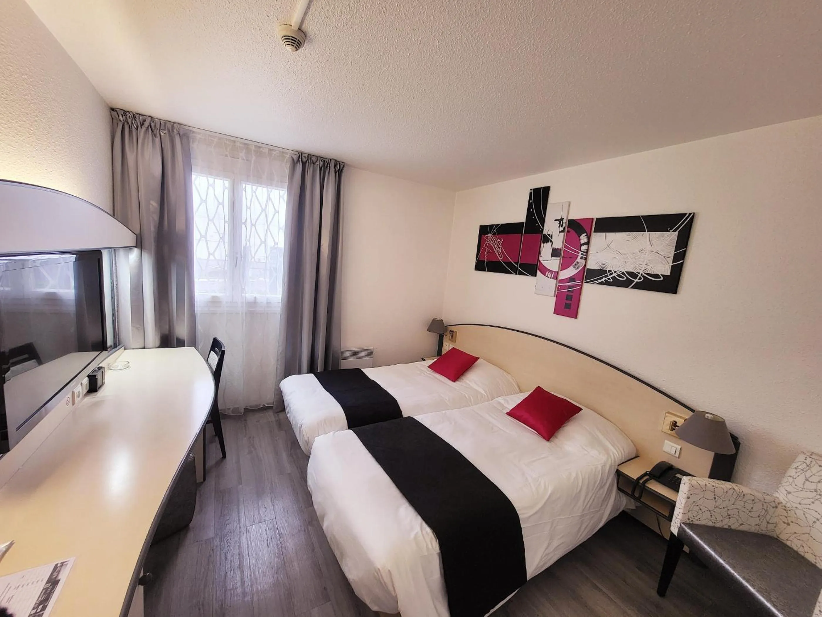 Twin Room in Citotel Hôtel Le Capricorne