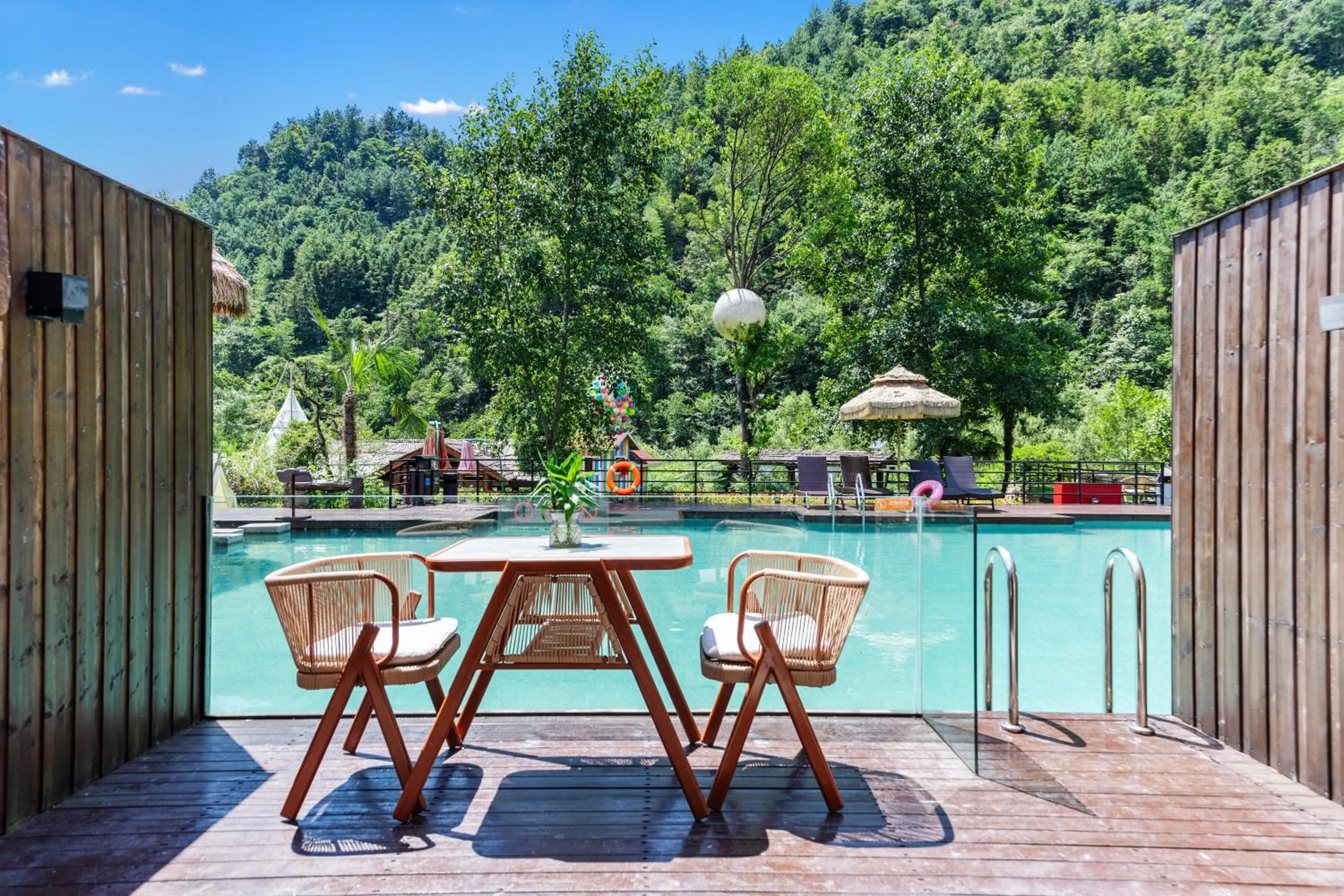Infinity Pool Deluxe King Room with Balcony and Pool Ladder for Direct Pool Access from Balcony in Homeward Mountain Resort