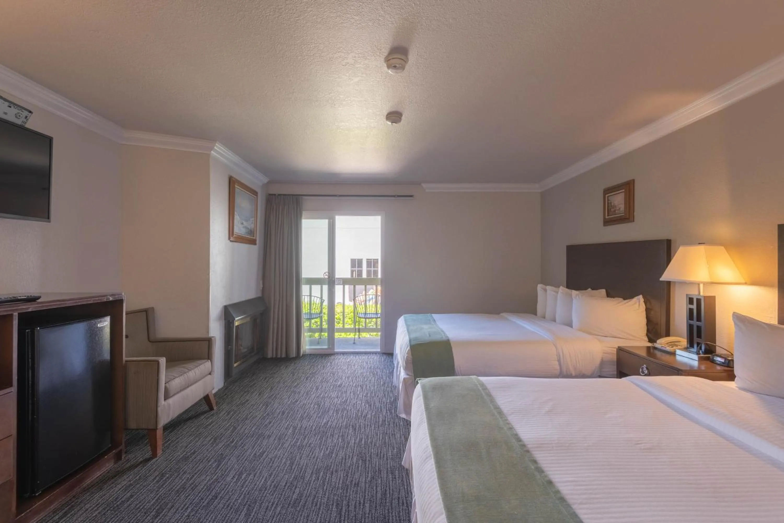 Two Queen Beds with Fireplace in Cannery Row Inn