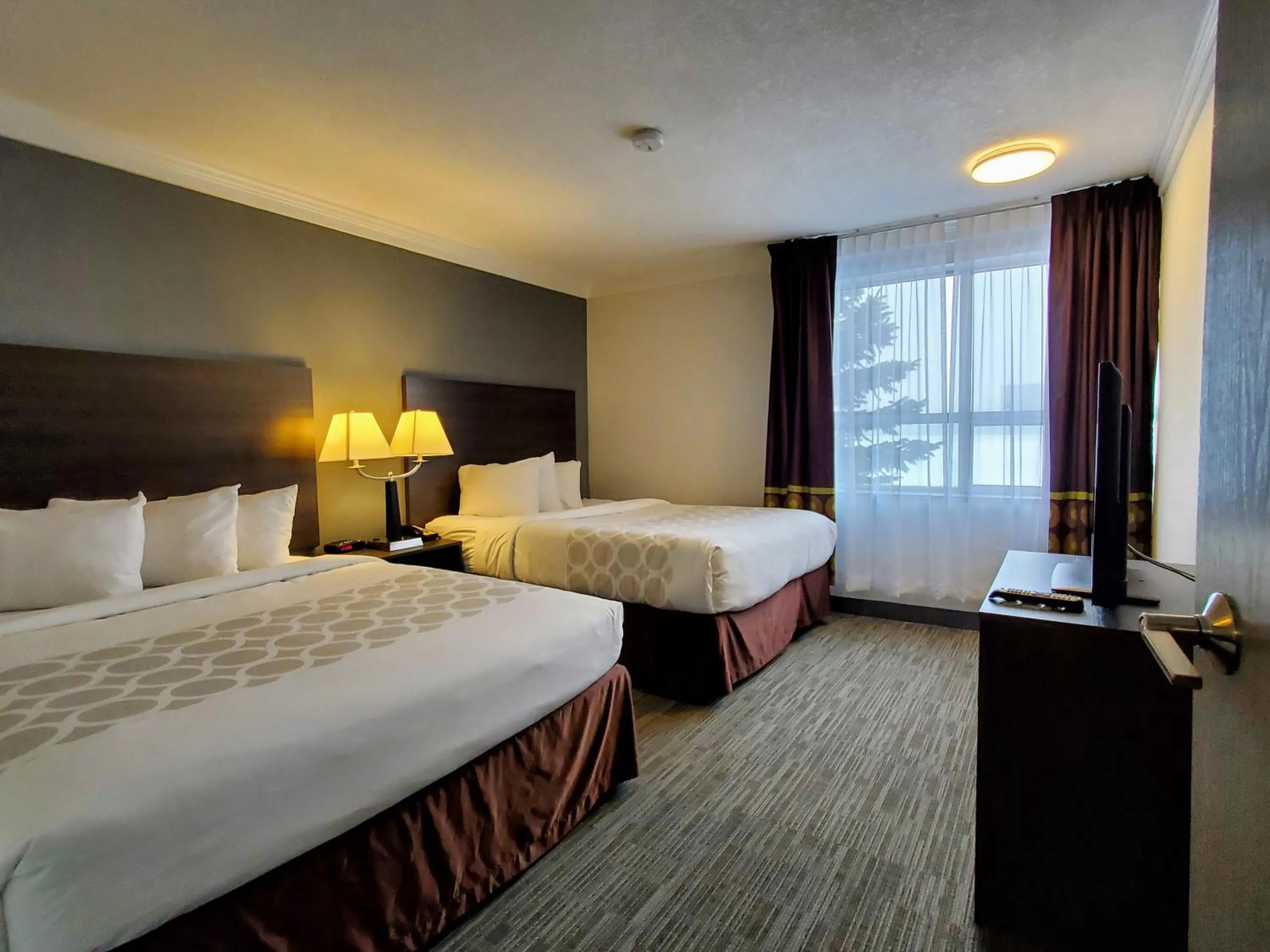 Pacific Queen Suite with Two Queen Beds and Kitchenette - Non-Smoking in Super 8 by Wyndham Macleod Trail Calgary