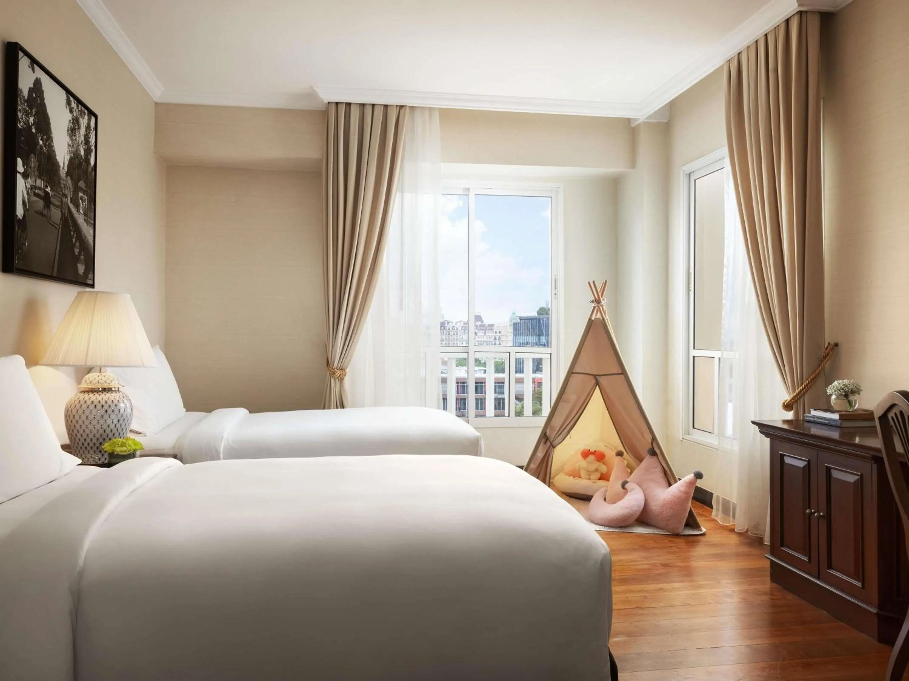 Junior Family Suite with One King Bed and Two Single Beds in Sofitel Phnom Penh Phokeethra