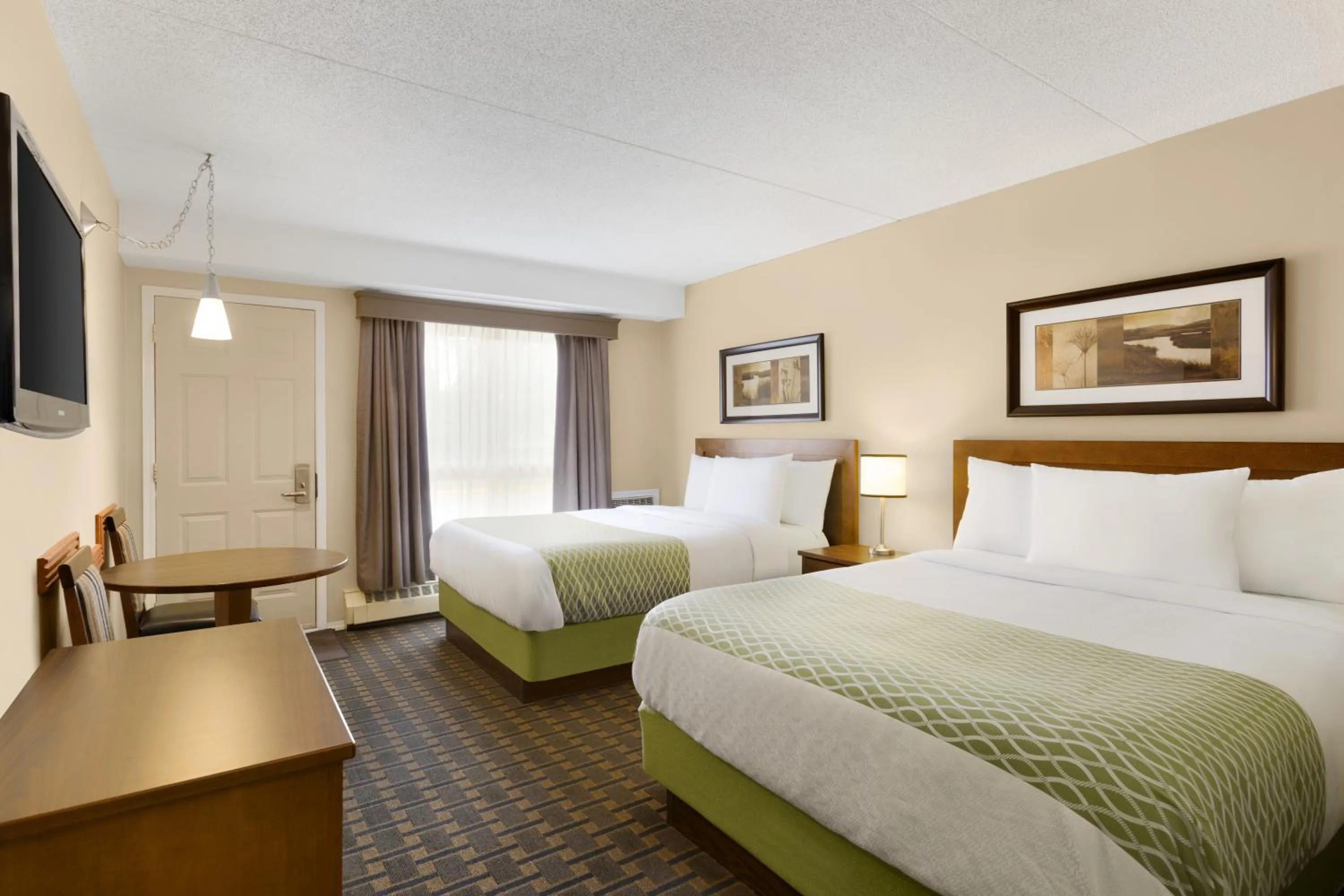 Queen Room with Two Queen Beds - Ground Floor in Colonial Square Inn & Suites