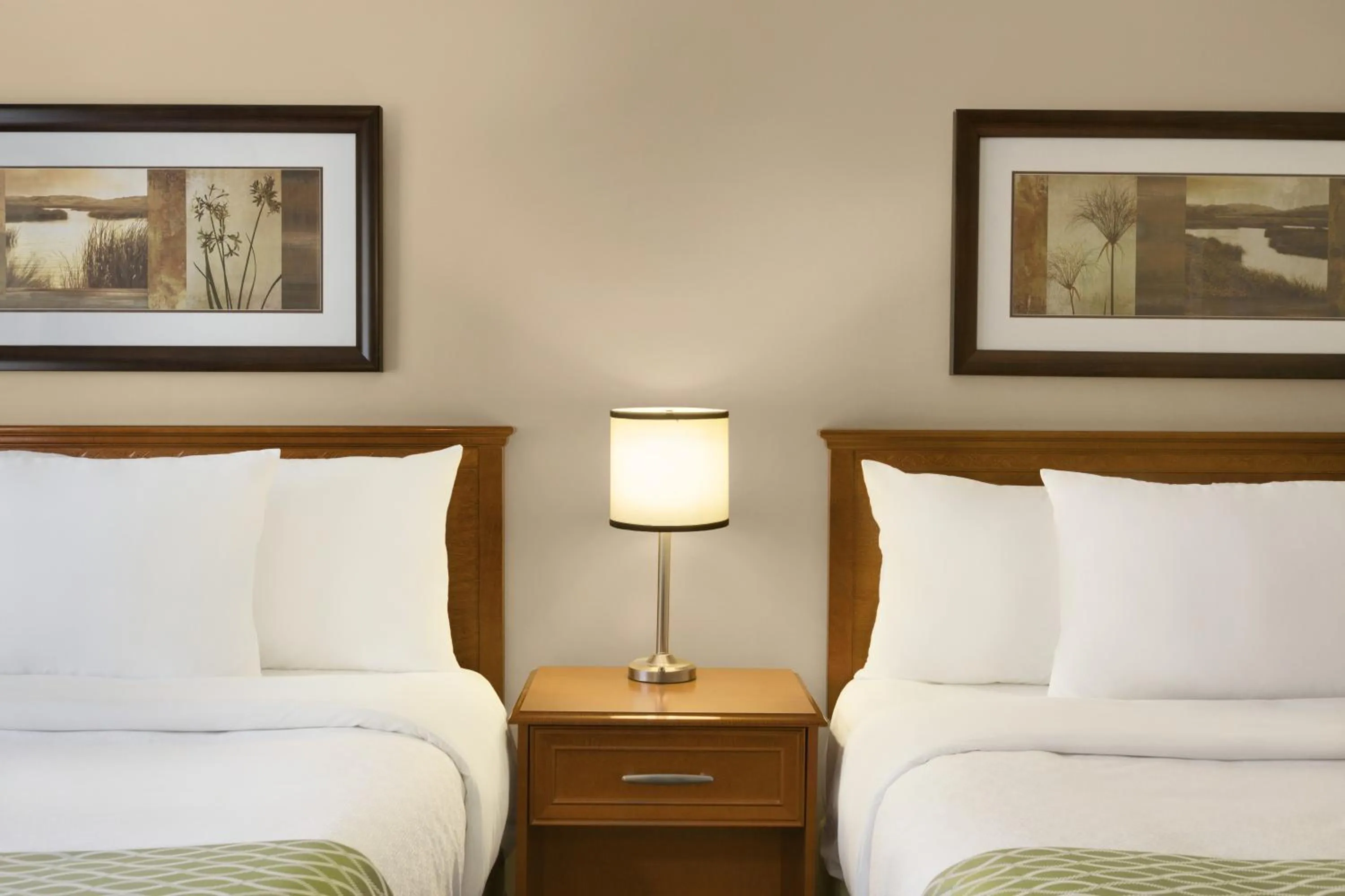 Queen Room with Two Queen Beds - Second Floor in Colonial Square Inn & Suites