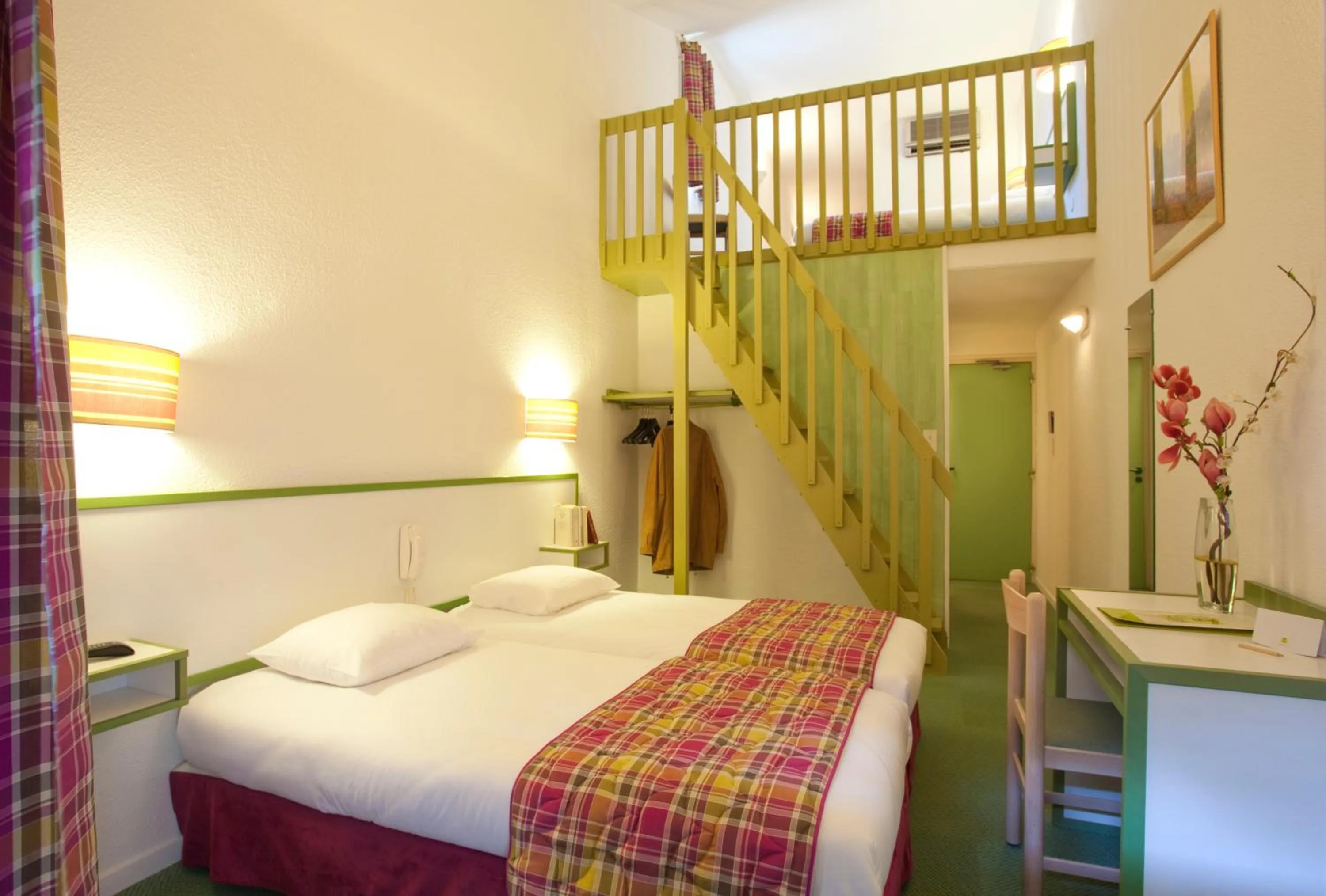 Quadruple Room with Terrace in Logis Hôtel Restaurant Les Cèdres