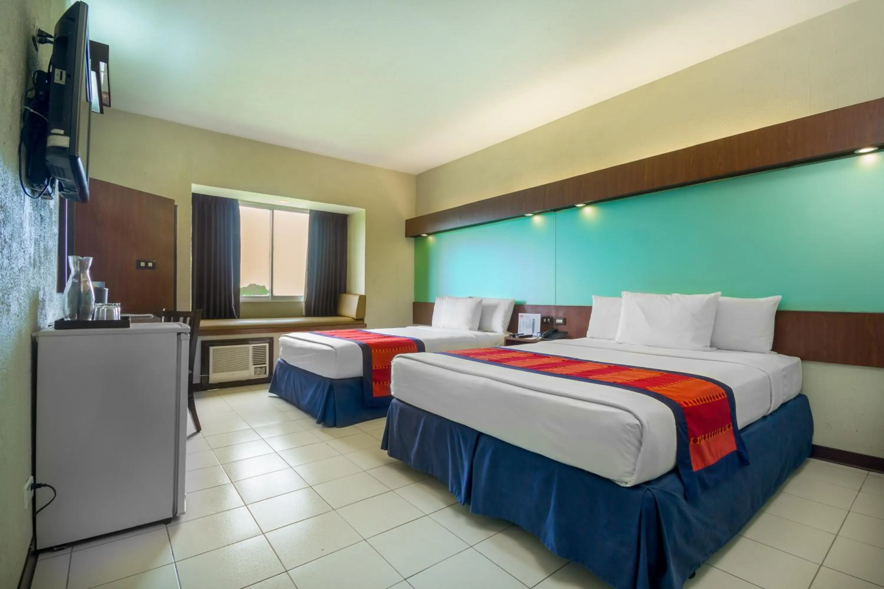 Queen Room with Two Queen Beds - Non-Smoking in Microtel by Wyndham Eagle Ridge