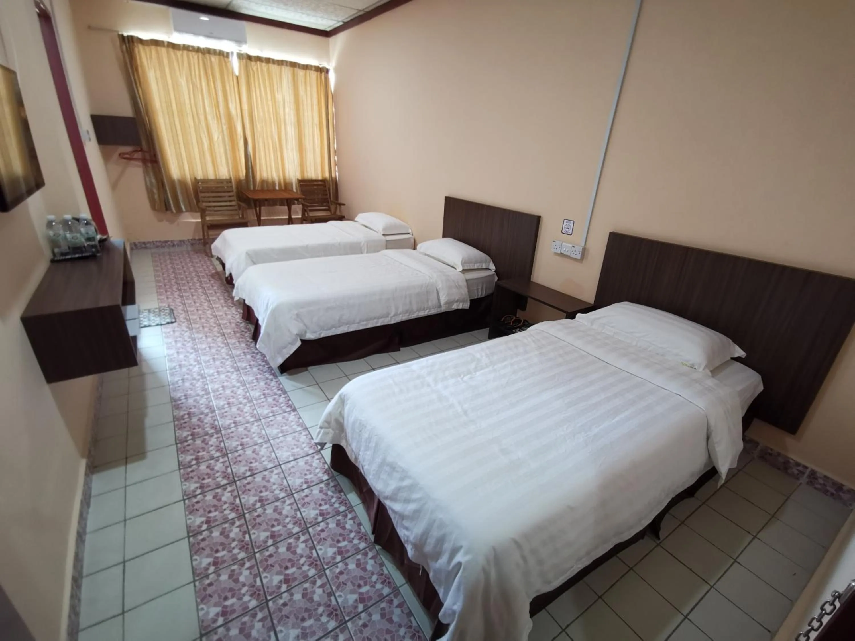 Double or Twin Room with Extra Bed in Indah Inn