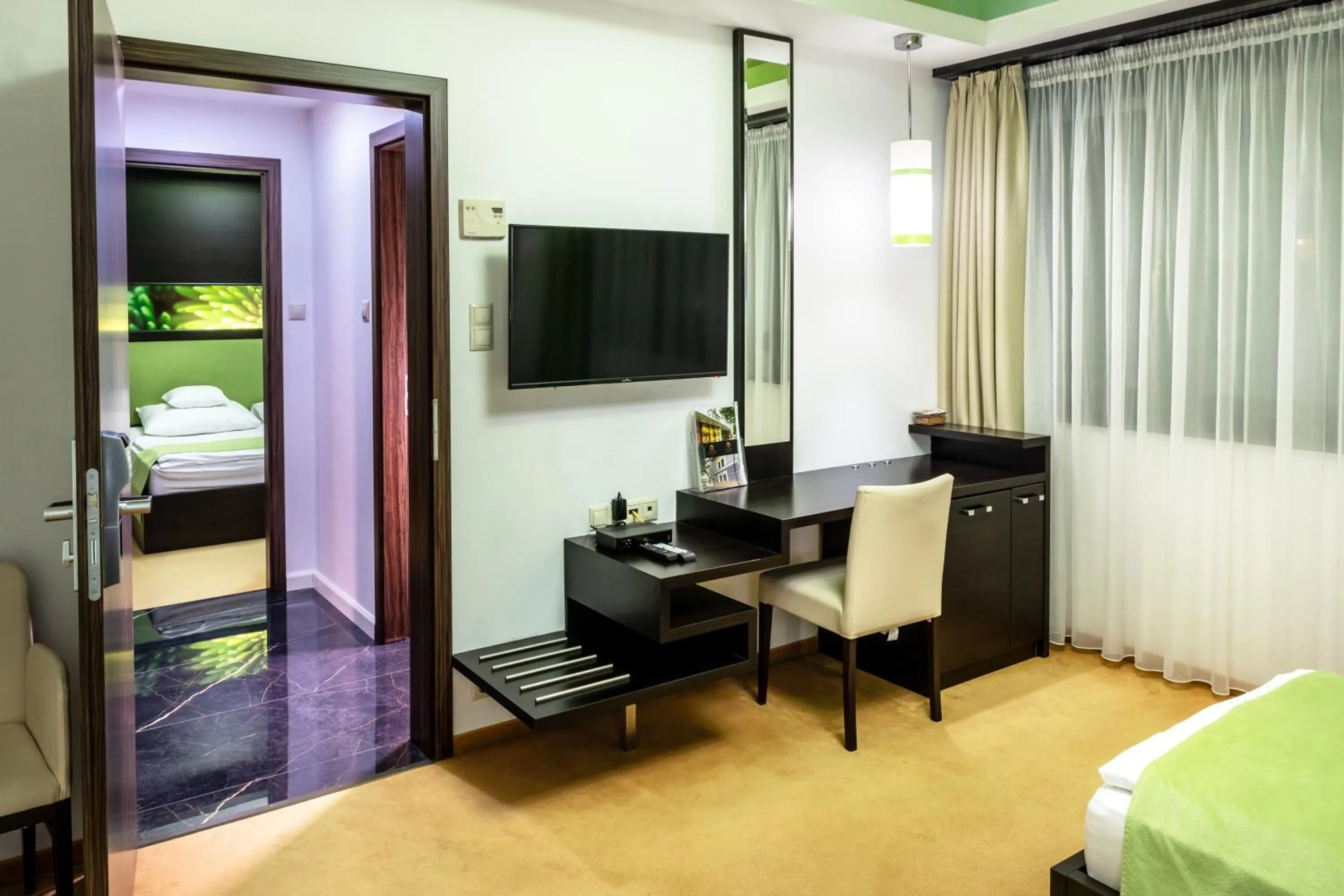 Family Room with Garden View in Corso Boutique Hotel