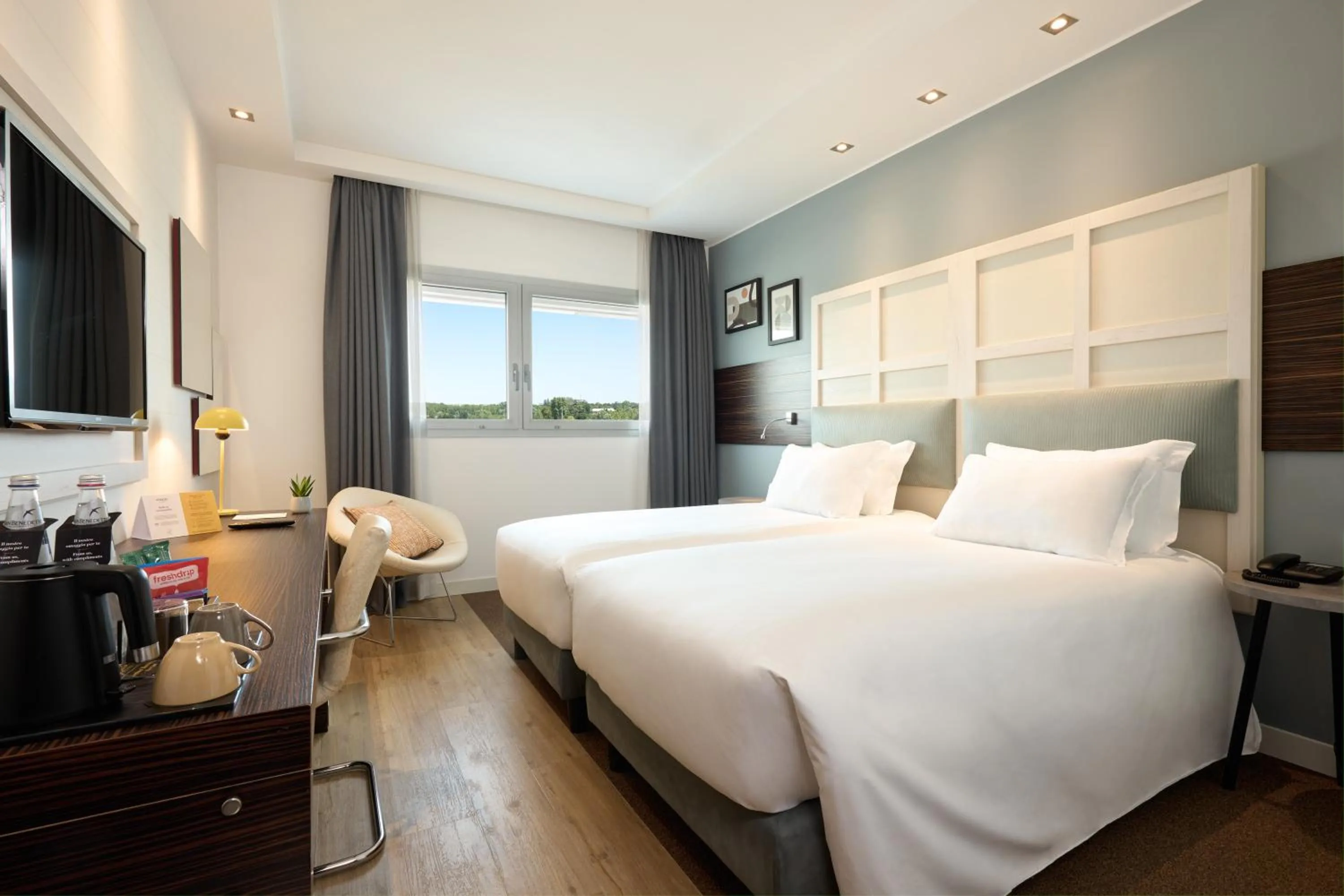 Standard Room with One Queen Bed and Two Single Beds in voco Venice Mestre - The Quid by IHG