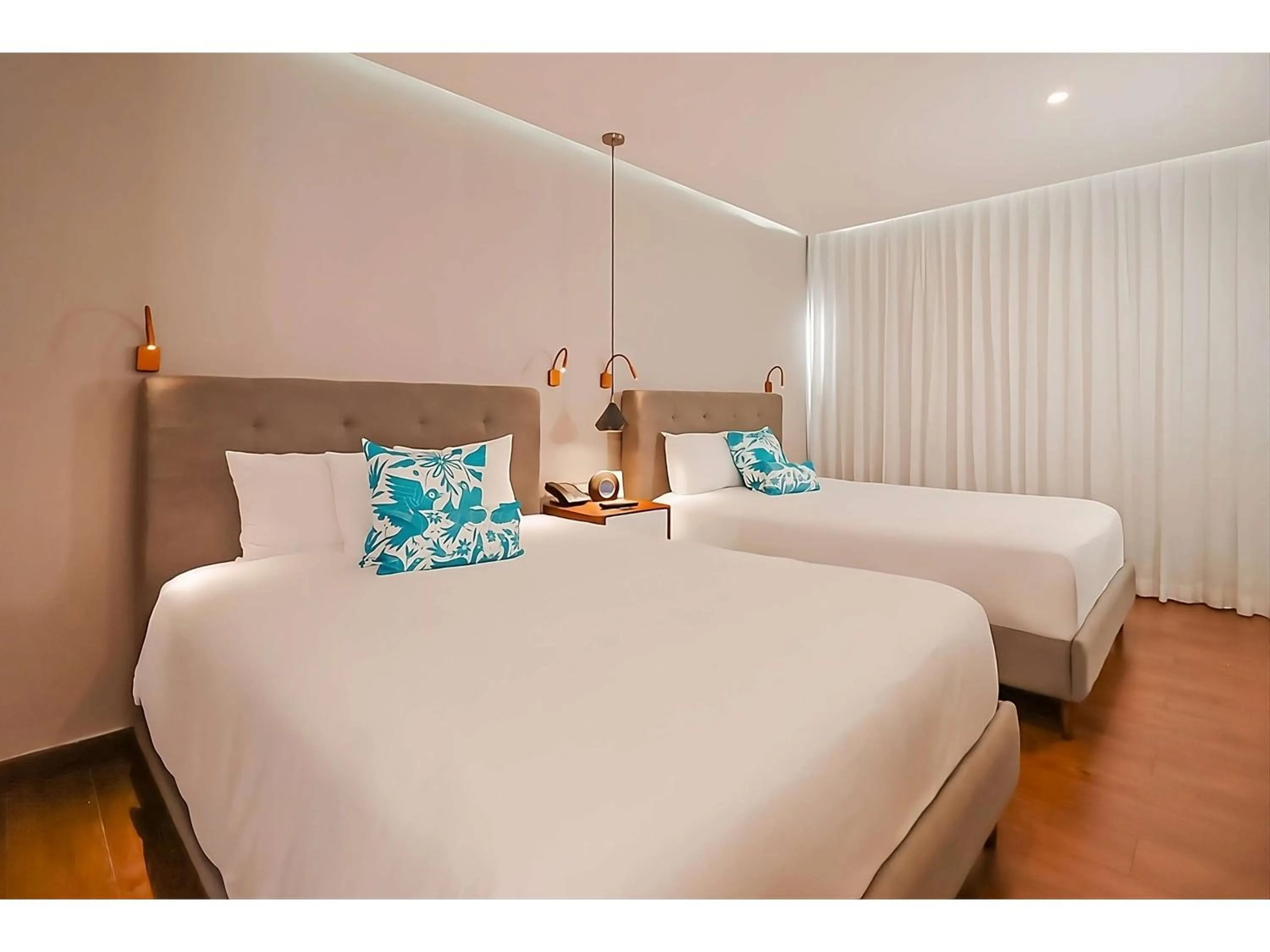 Deluxe Room with Tow Double Beds - Courtyard View in The Fives Downtown Hotel & Residences, Curio Collection by Hilton