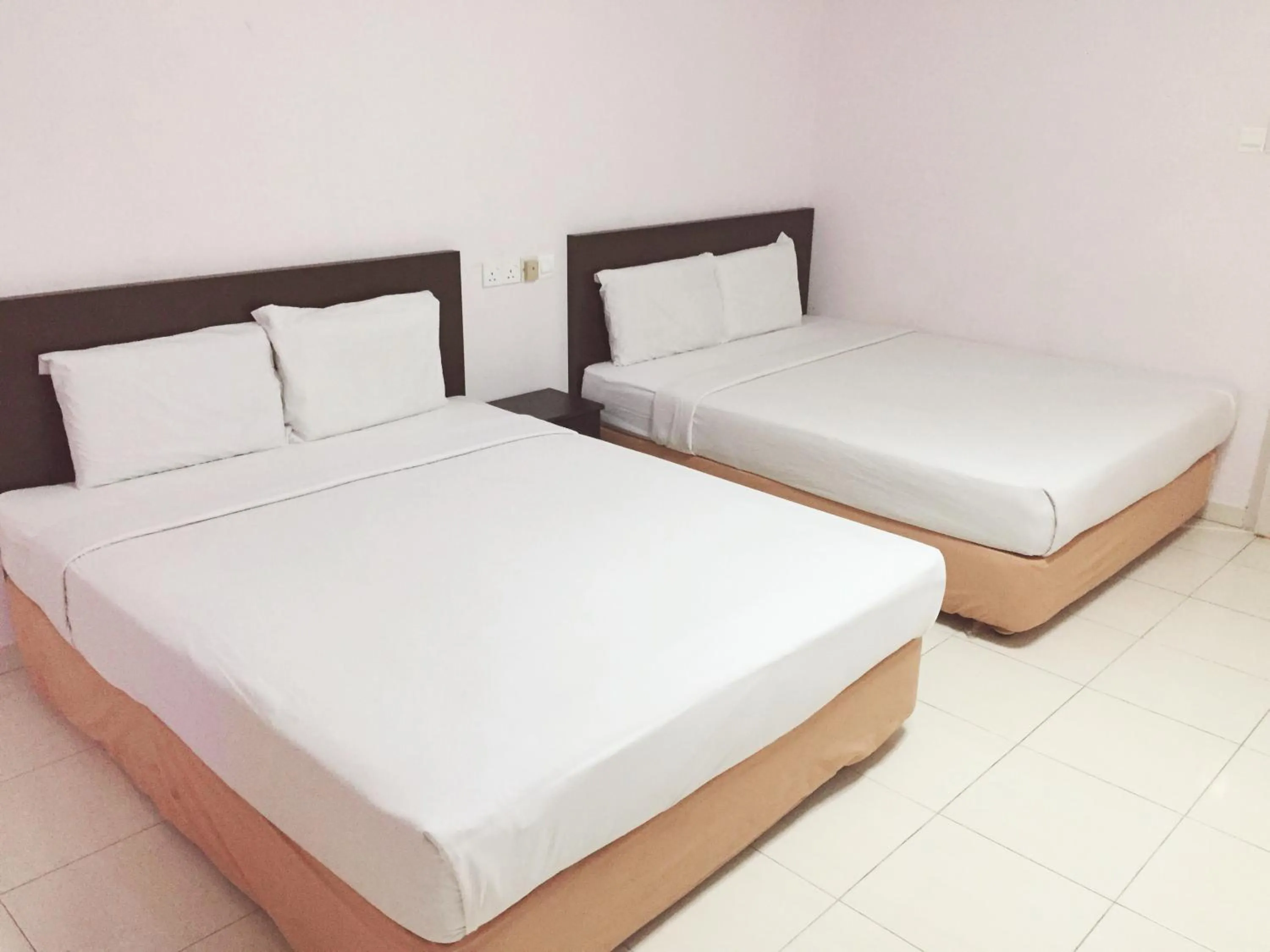 Deluxe Queen Room with Two Queen Beds in Raja Inn