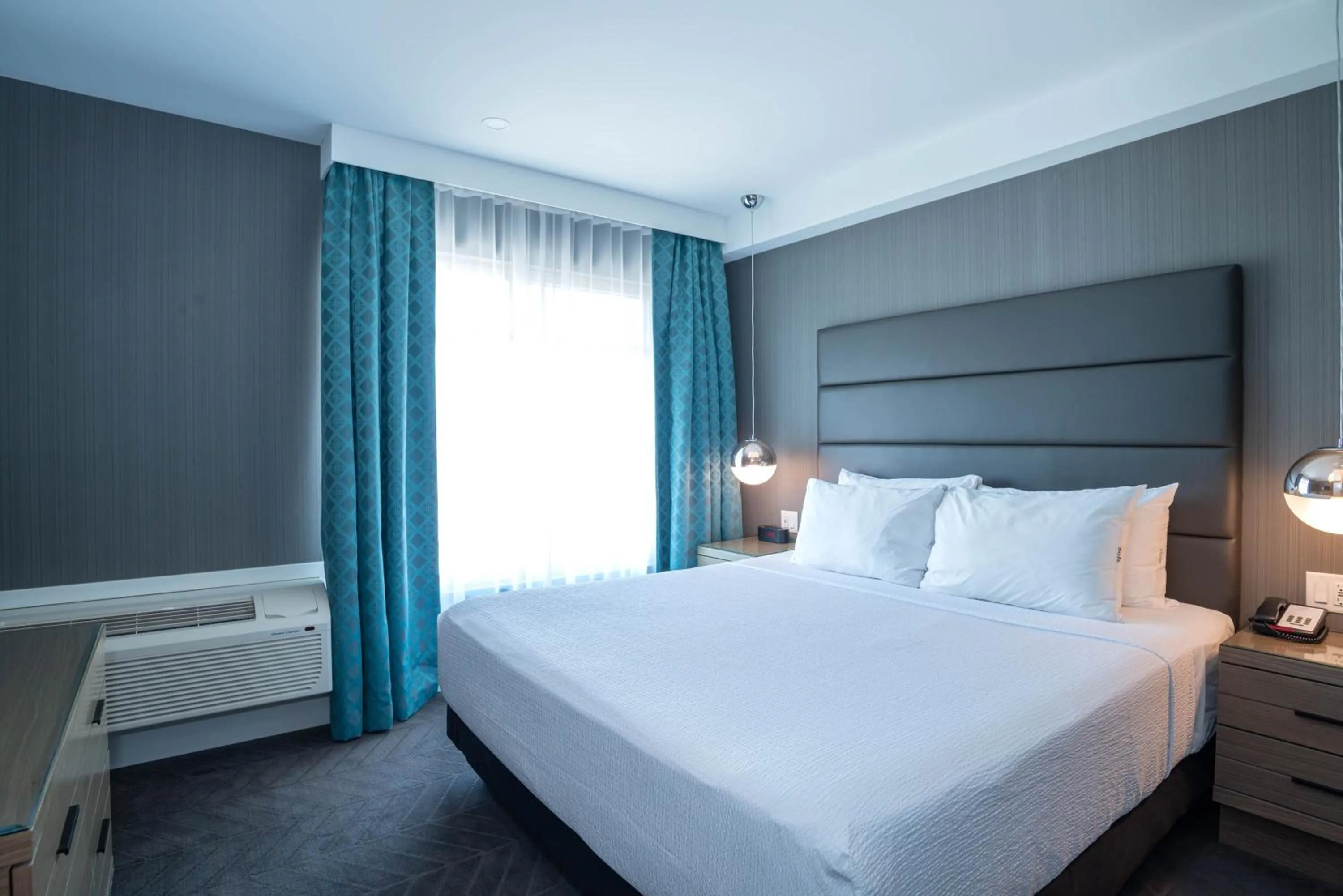 Signature Suite, 1 King Bed, Sofa Bed, Kitchen in Sandman Signature Calgary Airport Hotel