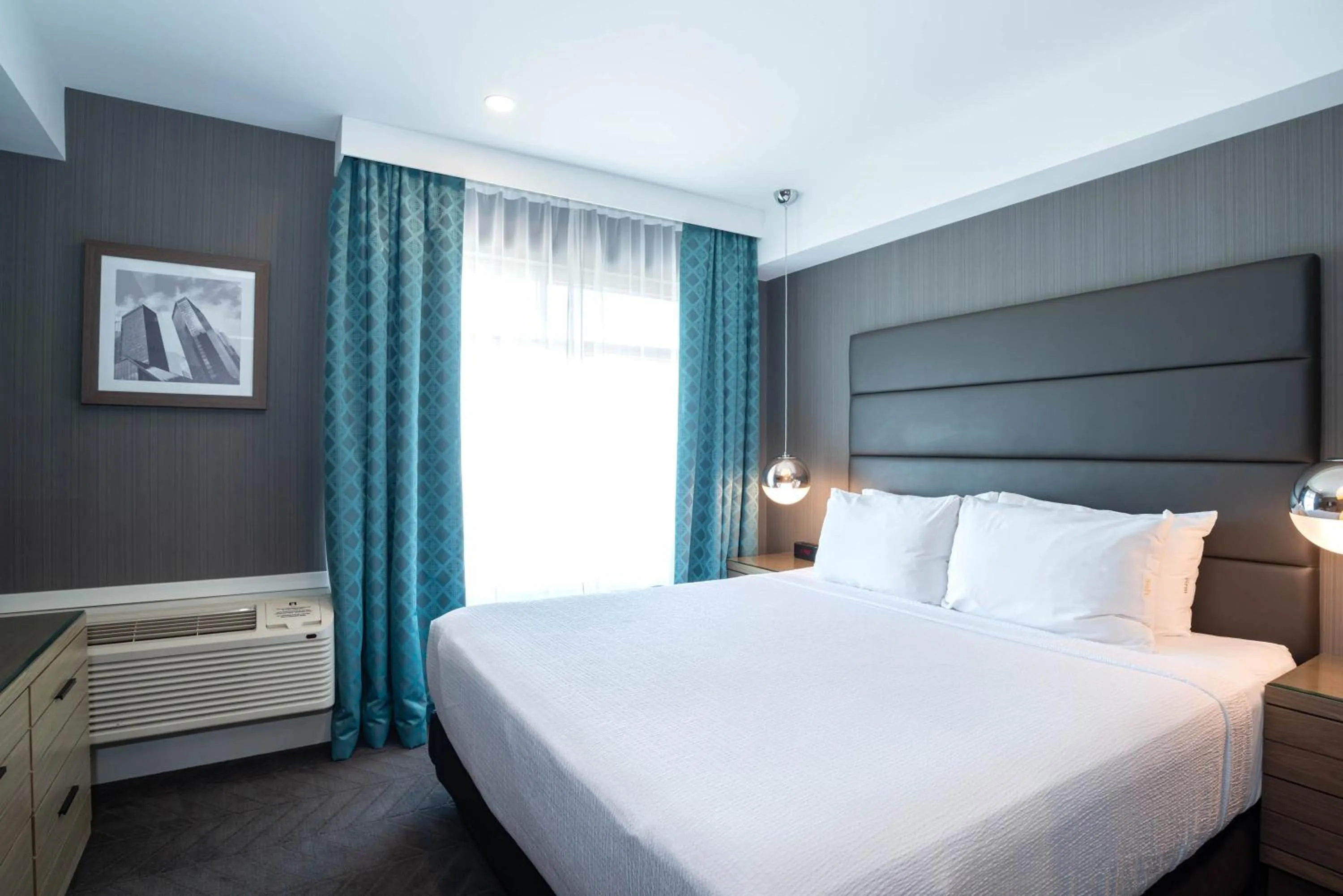 Signature Suite, 1 King Bed, Sofa Bed, Kitchenette in Sandman Signature Calgary Airport Hotel