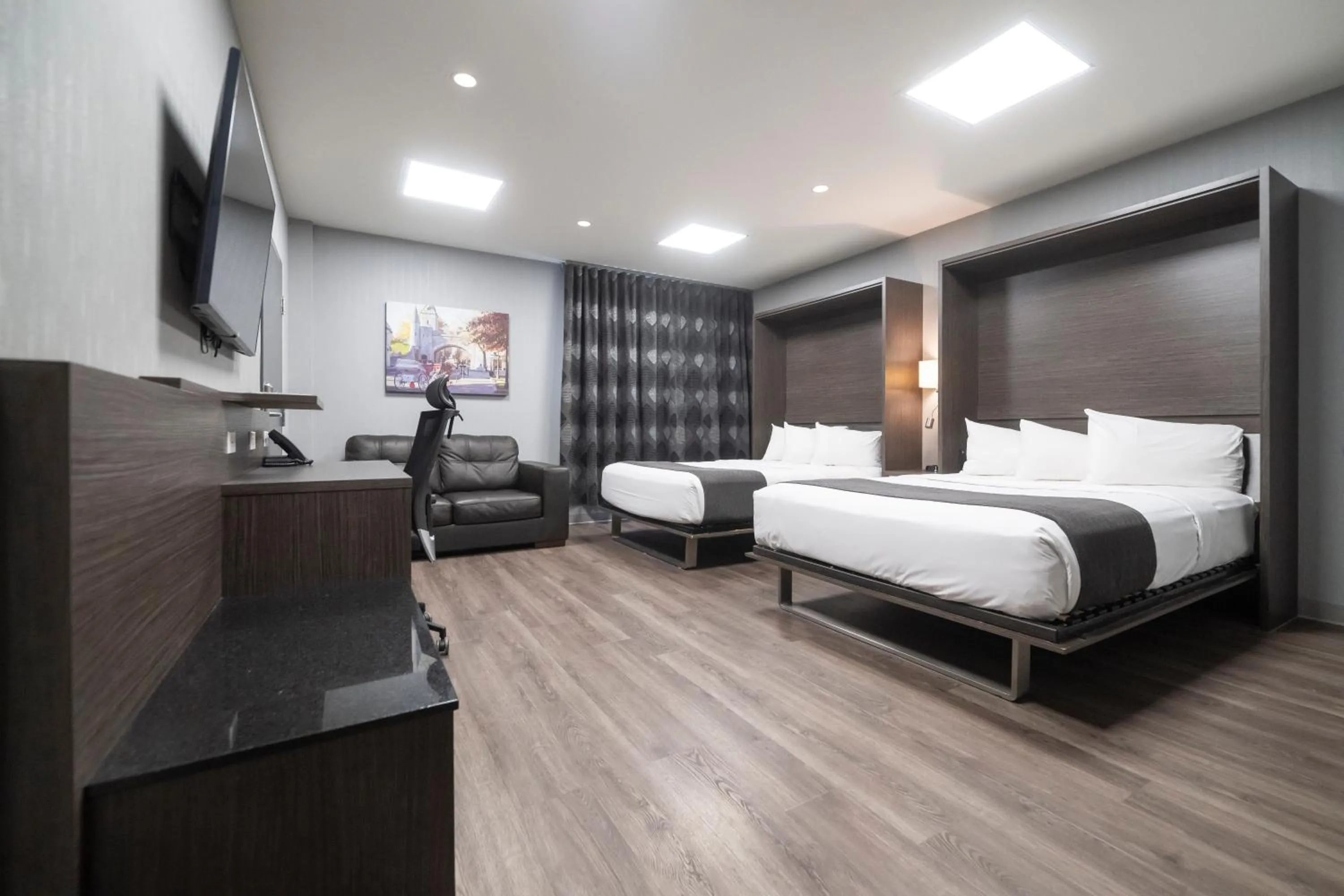 Superior Queen Room with Two Queen Beds (2 Adults + 2 Children) in Hôtel & Suites Le Dauphin Québec