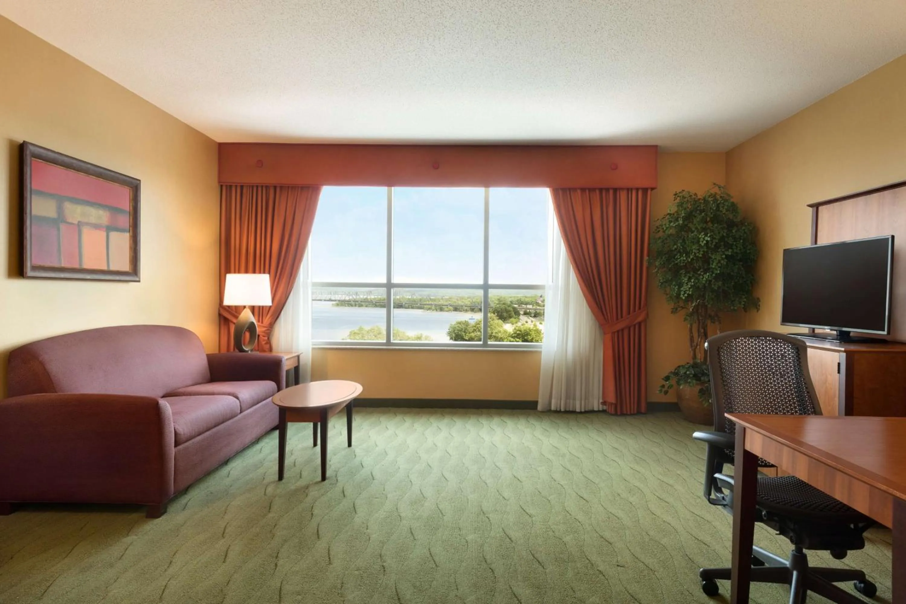 Premium King Corner Room with River View - Non-Smoking in Embassy Suites East Peoria Hotel and Riverfront Conference Center