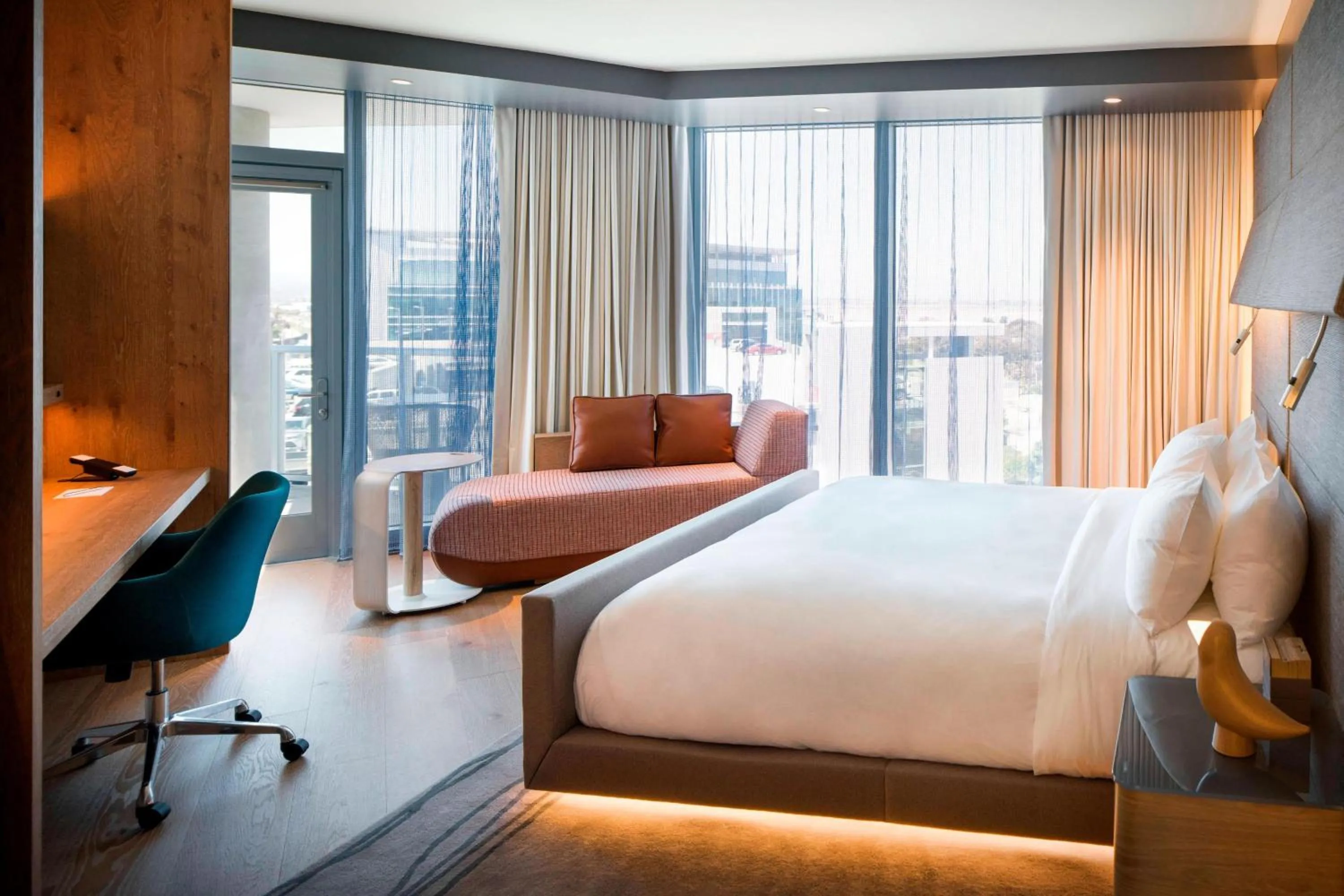 Corner King Guest Room with Balcony and Partial Bay View in Hotel Nia, Autograph Collection