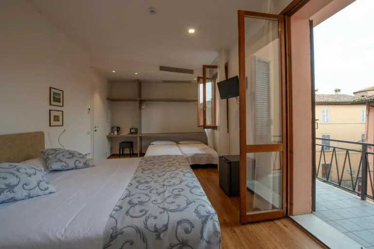 Comfort Quadruple Room with Balcony in Albergo La Rocca