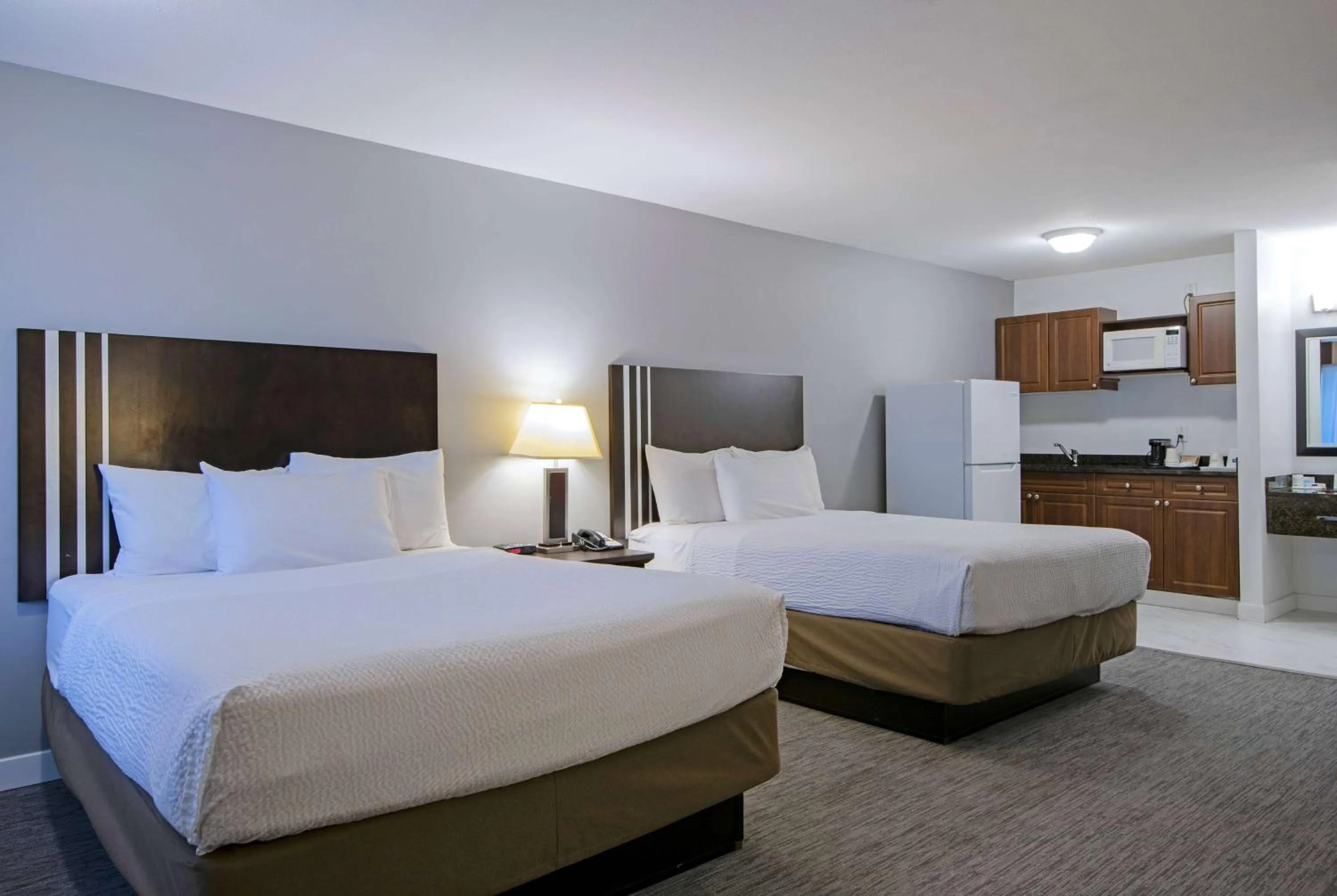 Two Queen Beds with Kitchenette in Travelodge by Wyndham Kamloops Mountview