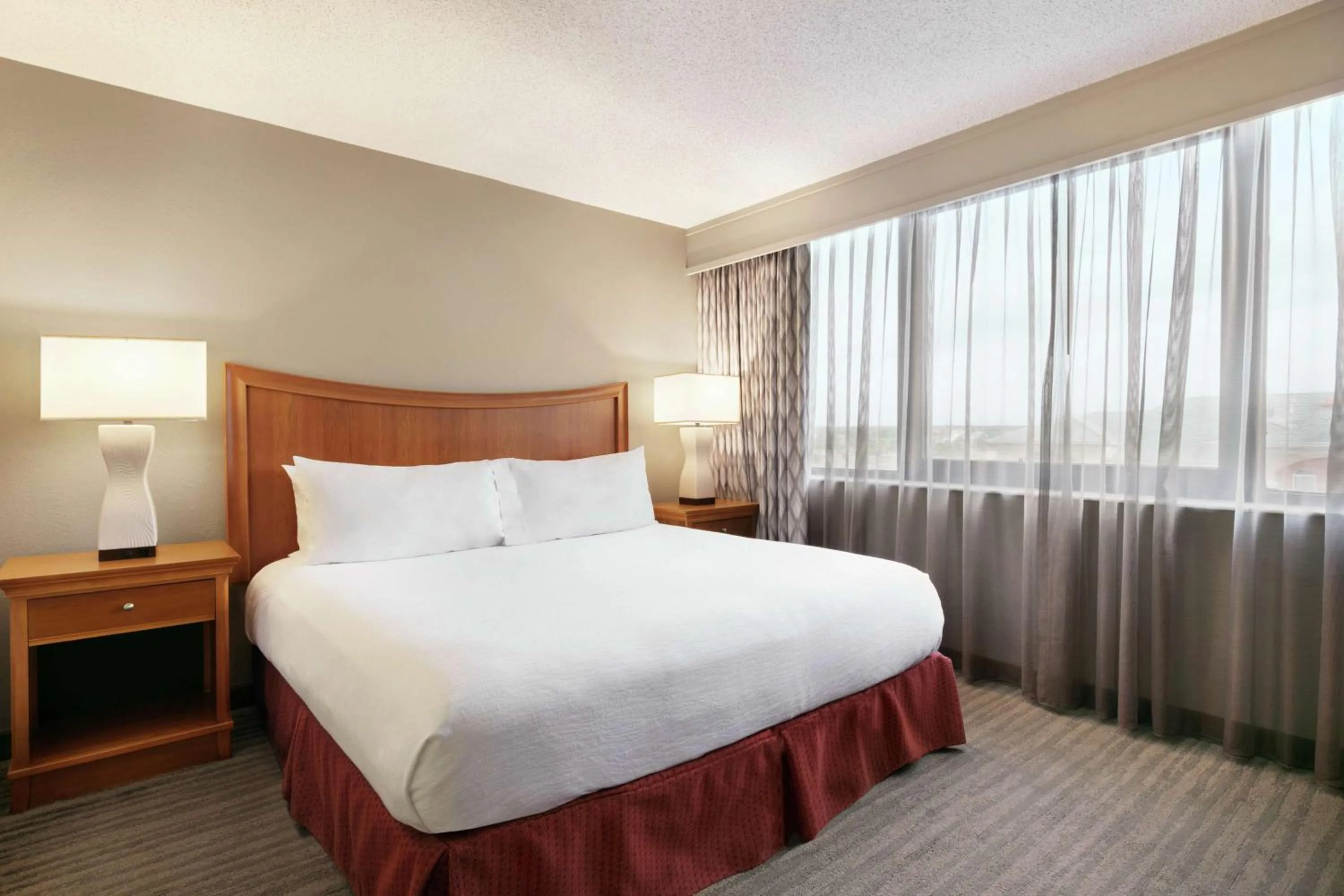 Corner Two-Room Suite with One King Bed and Sofa Bed in Embassy Suites by Hilton Orlando International Drive ICON Park