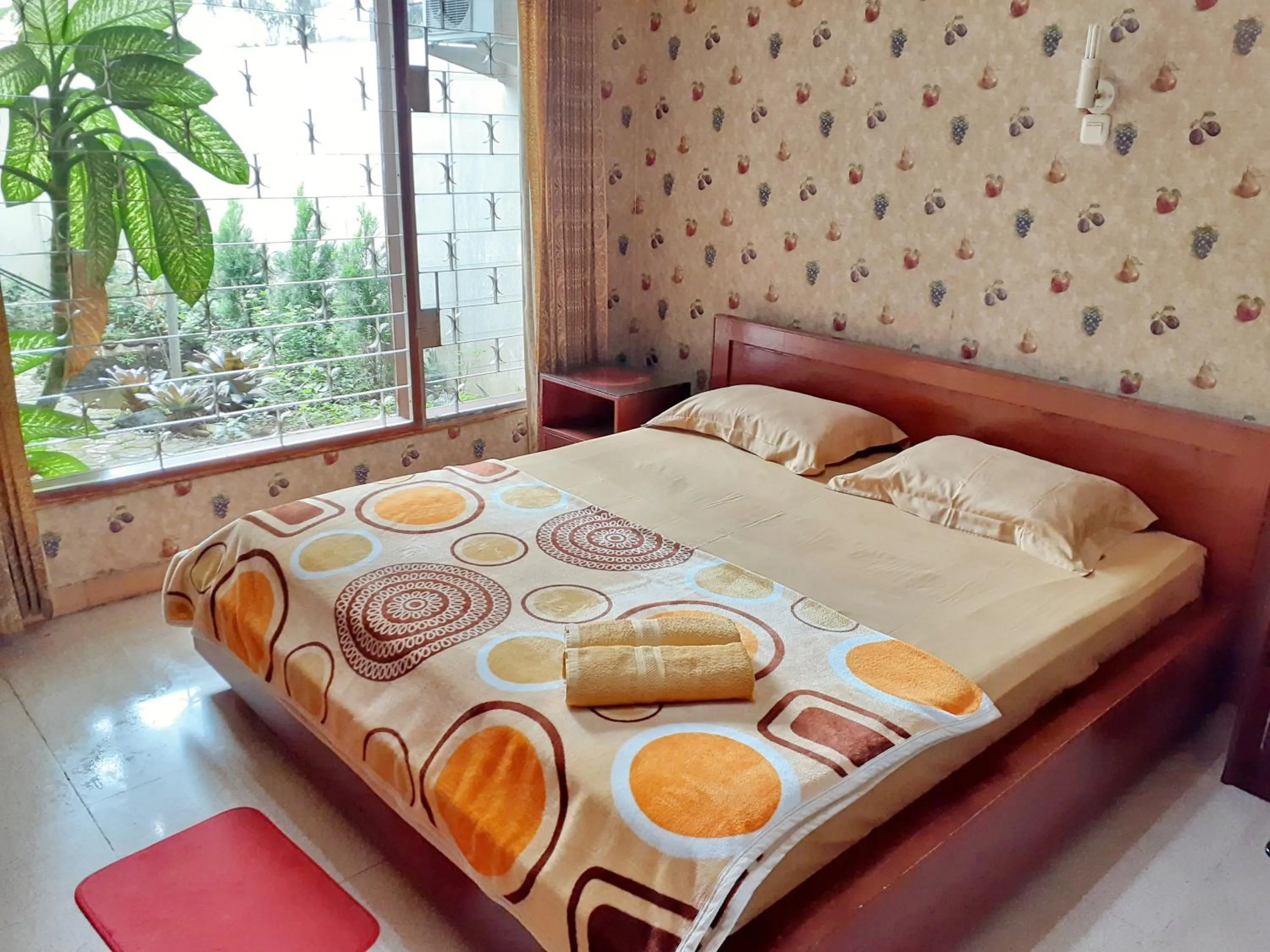King Room with Garden View in GIO Guesthouse Bogor