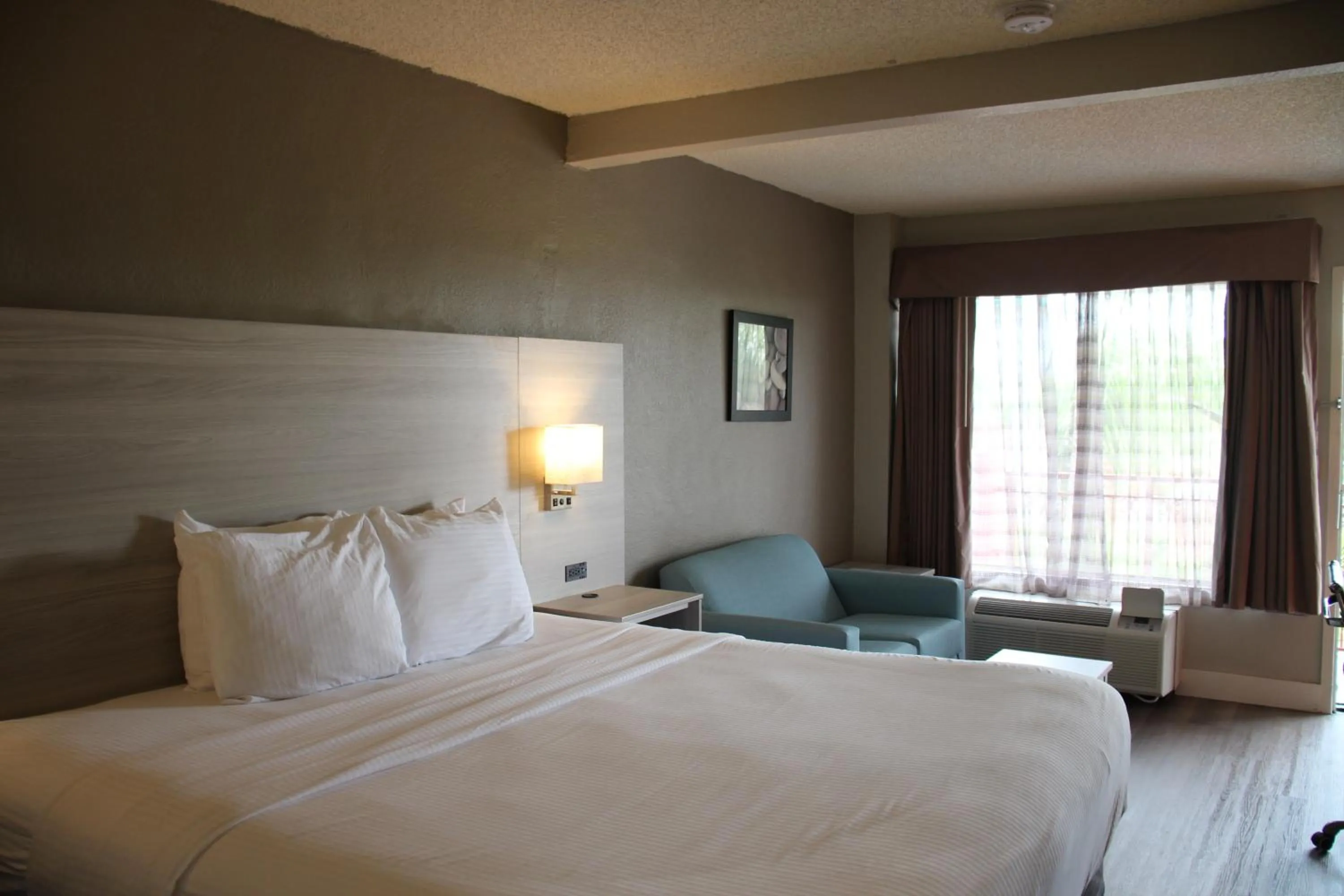 King Room with Balcony in Boca Suites Deerfield Beach; SureStay Collection by BW