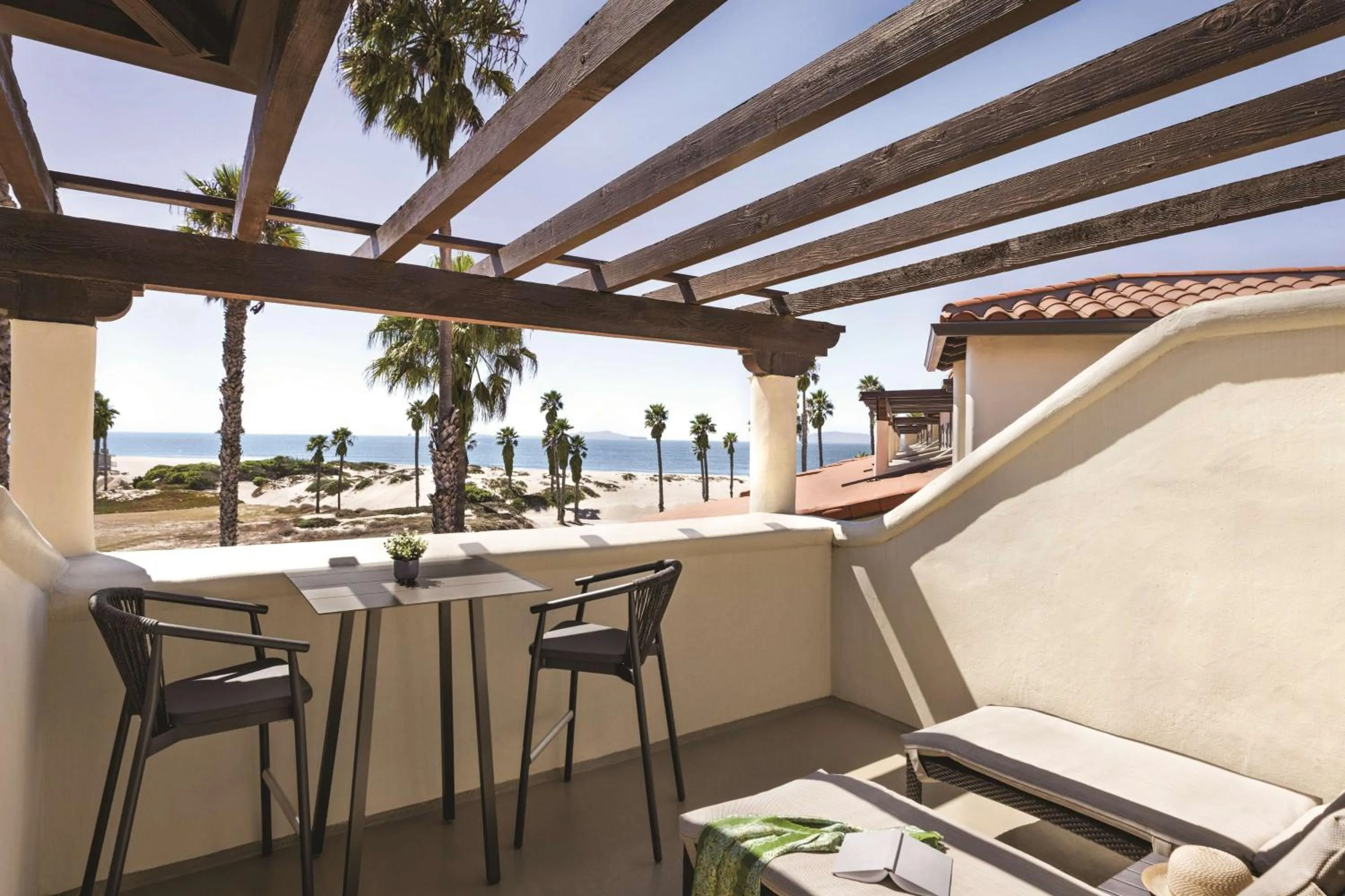 Queen Suite with Two Queen Beds and Partial Ocean View in Zachari Dunes on Mandalay Beach, Curio Collection by Hilton
