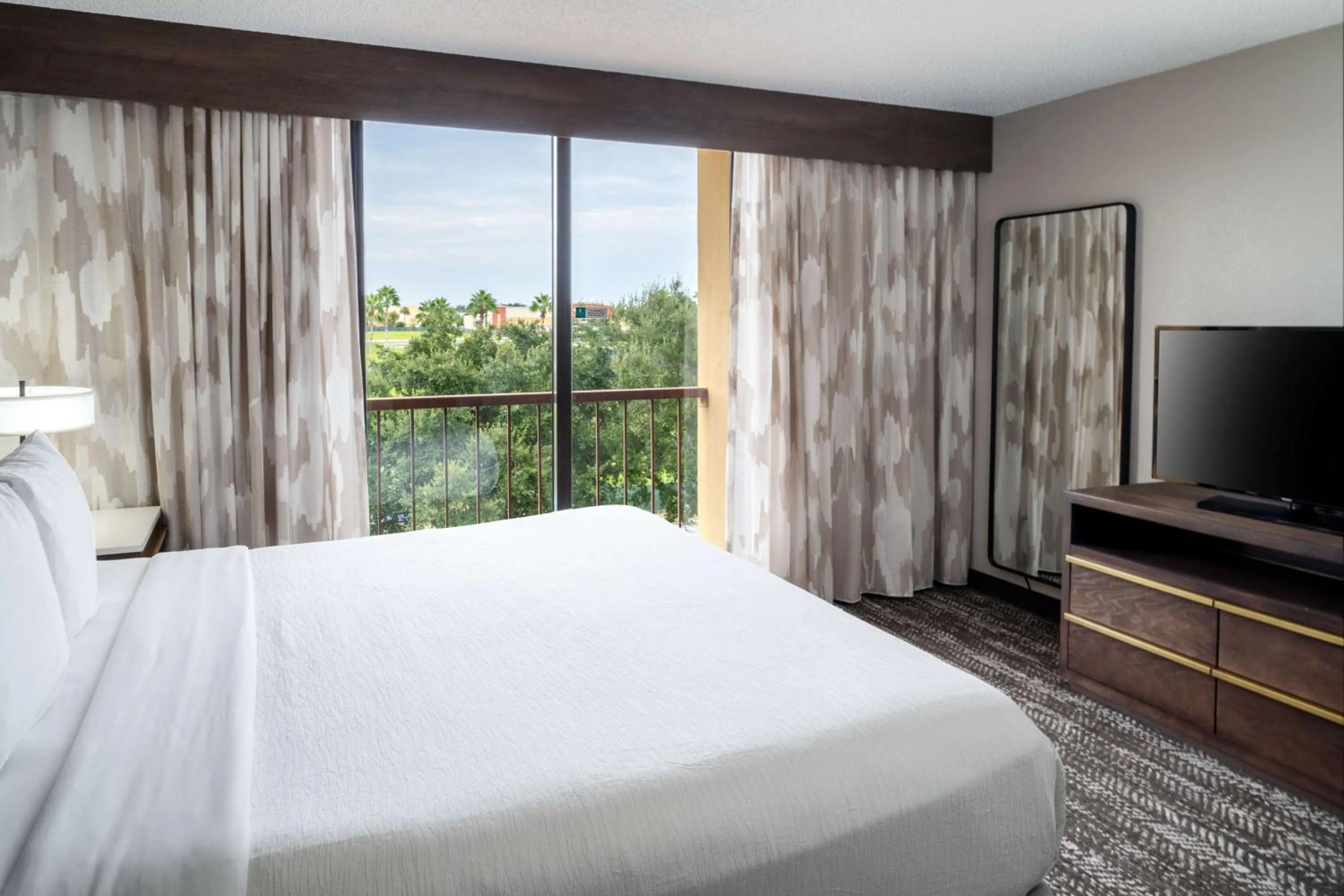 One-Bedroom King Suite with Lake View - Non-Smoking in Embassy Suites by Hilton Orlando North