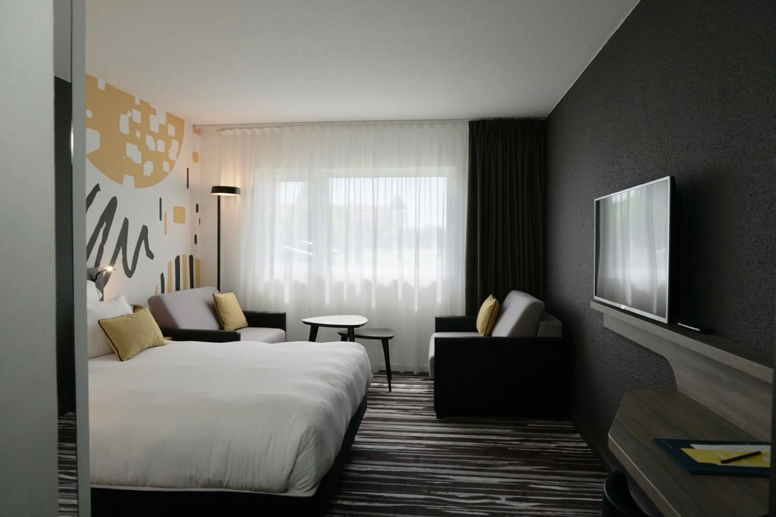 Superior Room With 1 Double Bed And 2 Sofa Beds in Golden Tulip Roissy Saint Witz