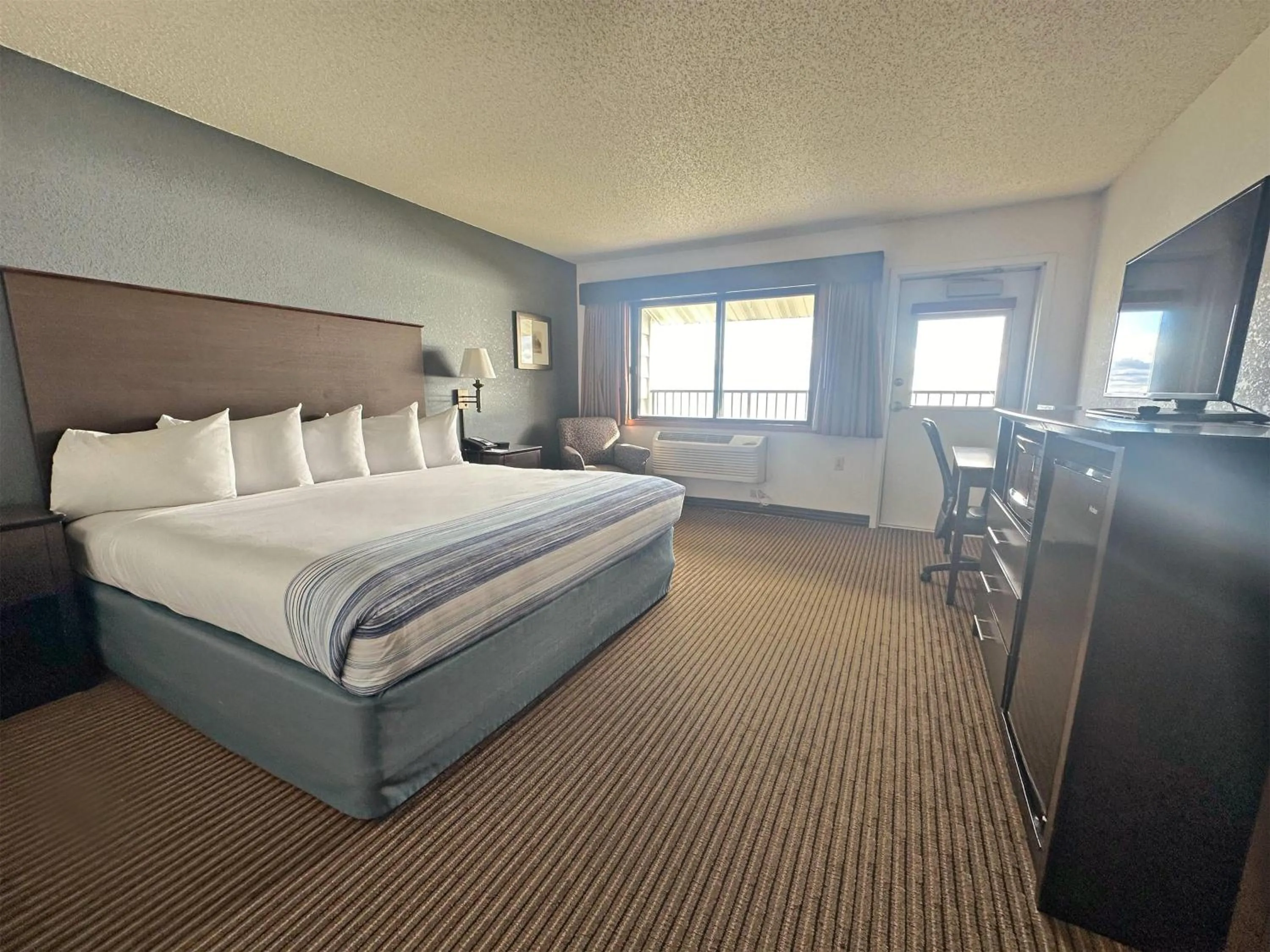 Deluxe King Room - Non-Smoking in AmericInn by Wyndham Menominee