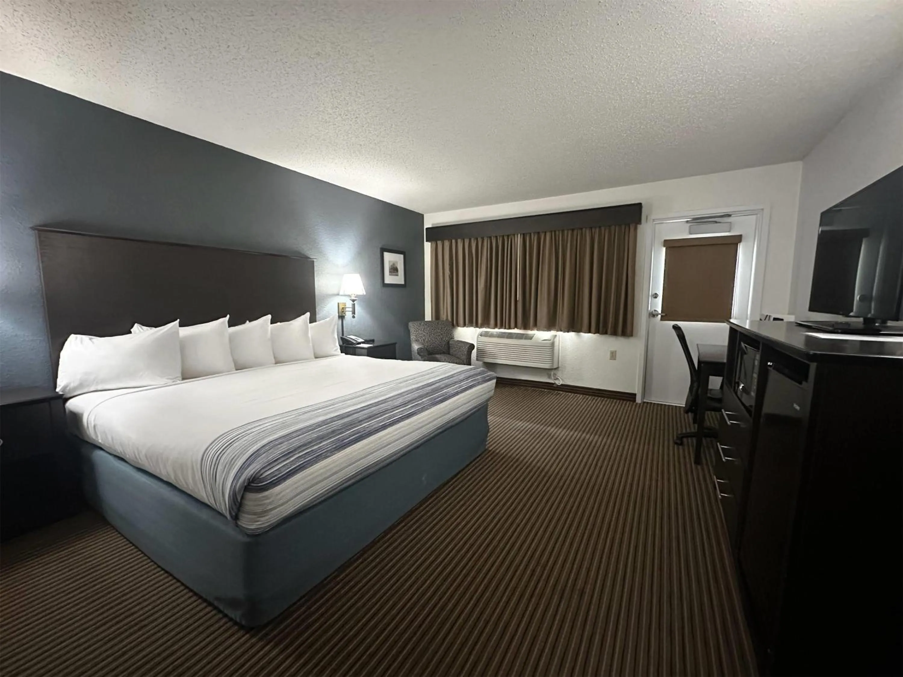 Superior King Room - Non-Smoking in AmericInn by Wyndham Menominee