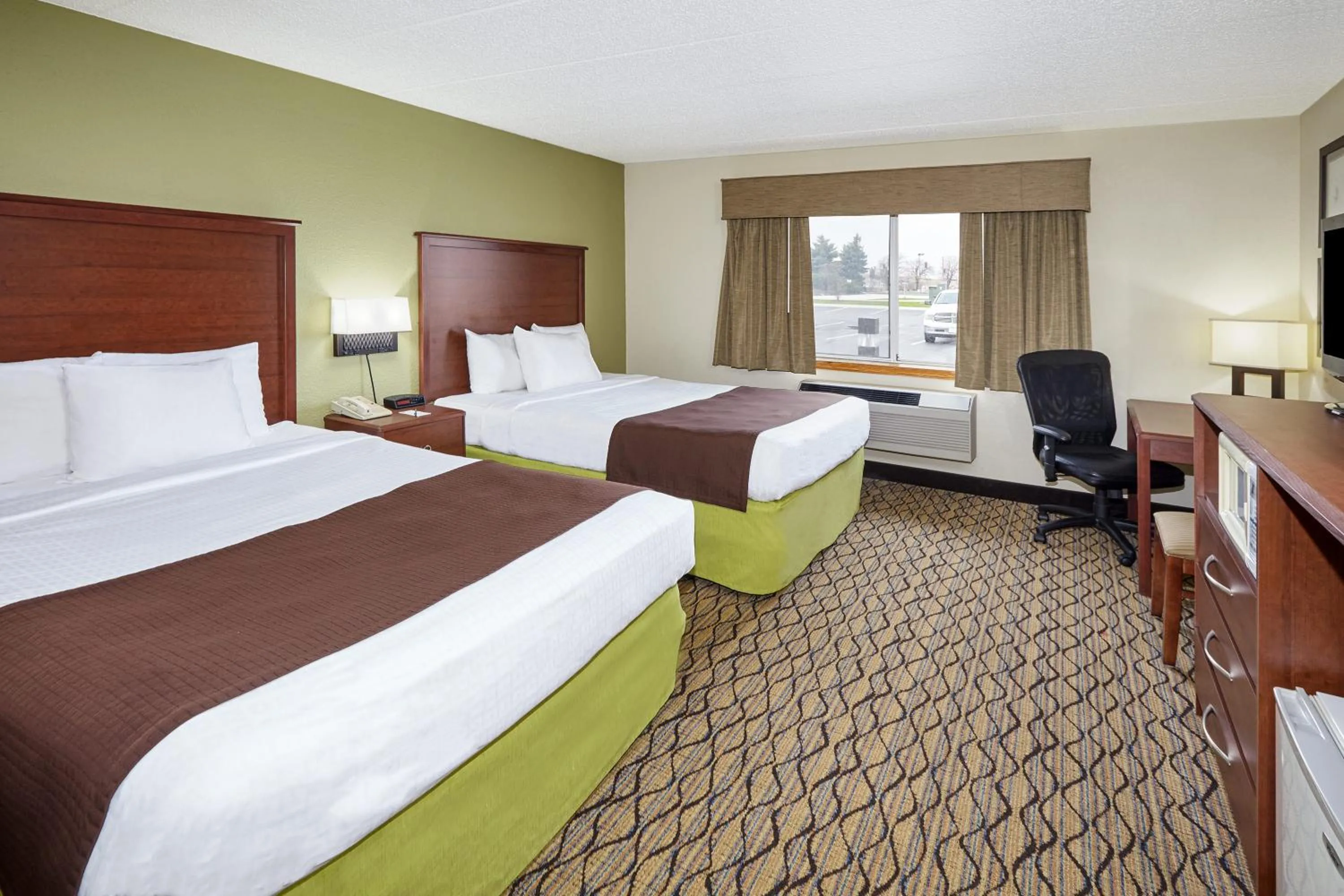 Queen Room with Two Queen Beds - Non-Smoking in AmericInn by Wyndham Sheboygan