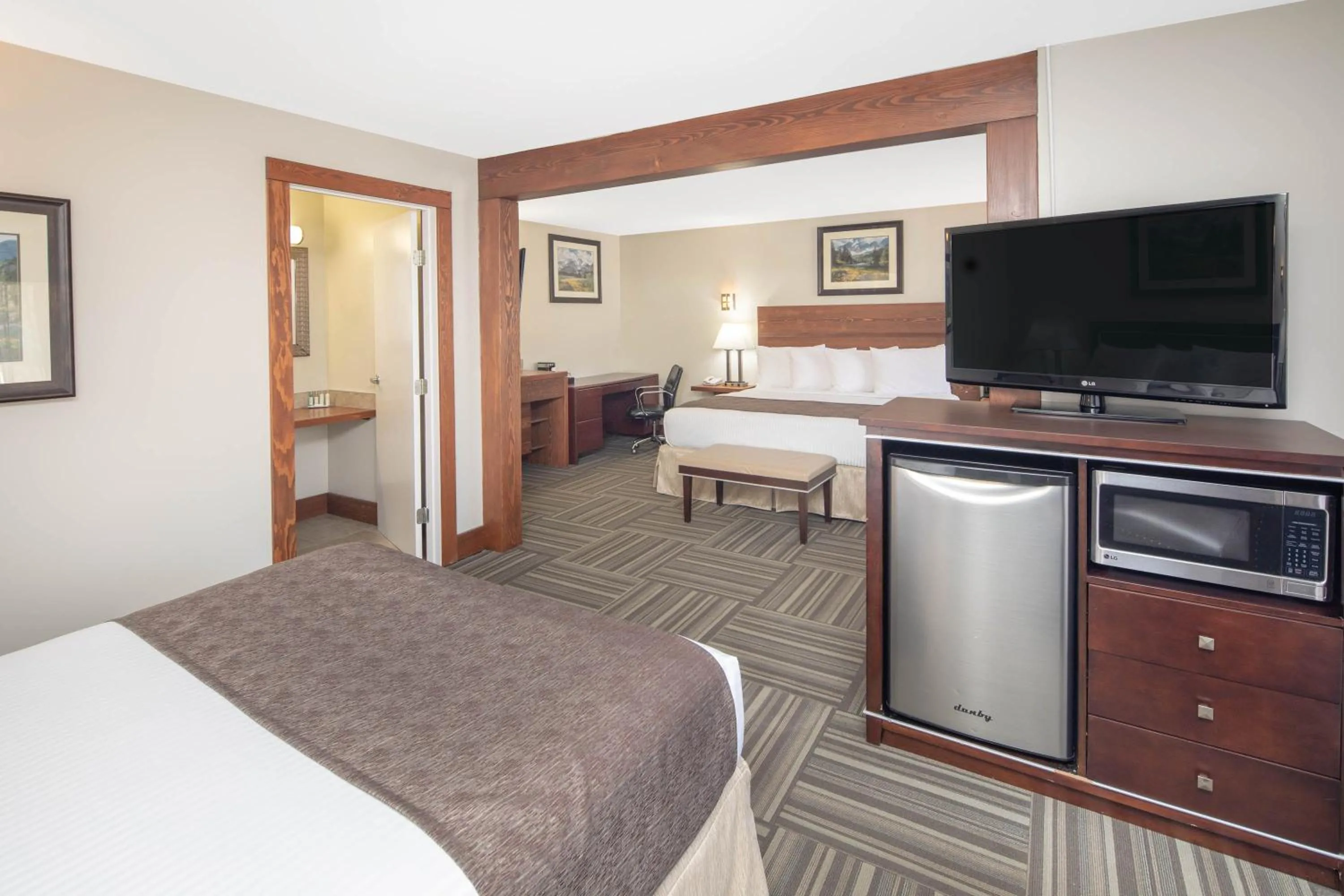 Studio Suite with One King Bed, One Queen Bed & One Sofa Bed - Ground Floor - Non-Smoking in Travelodge by Wyndham Golden Sportsman Lodge