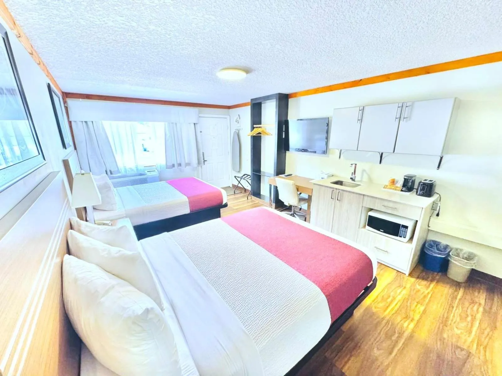 Queen Room with Two Queen Beds and Kitchenette - Pet-Friendly/Non-Smoking in Travelodge by Wyndham Golden Sportsman Lodge