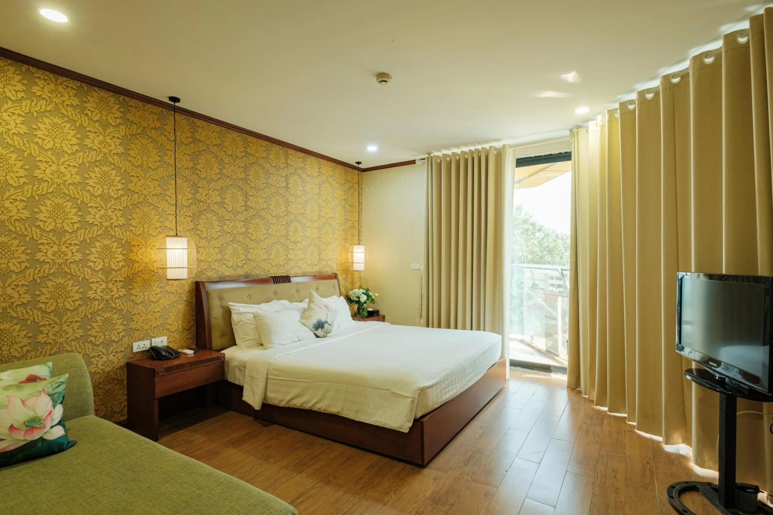 King Suite with Balcony in Sunset Westlake Hanoi Hotel